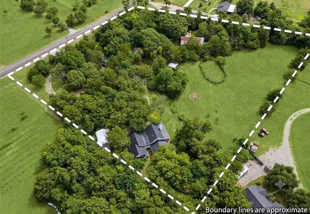 Fully fenced 4.32 private acres includes a pond, seasonal creek, barn, horse corral, garden, firepit, treehouse, garden, 2 acres of open pasture, and more!