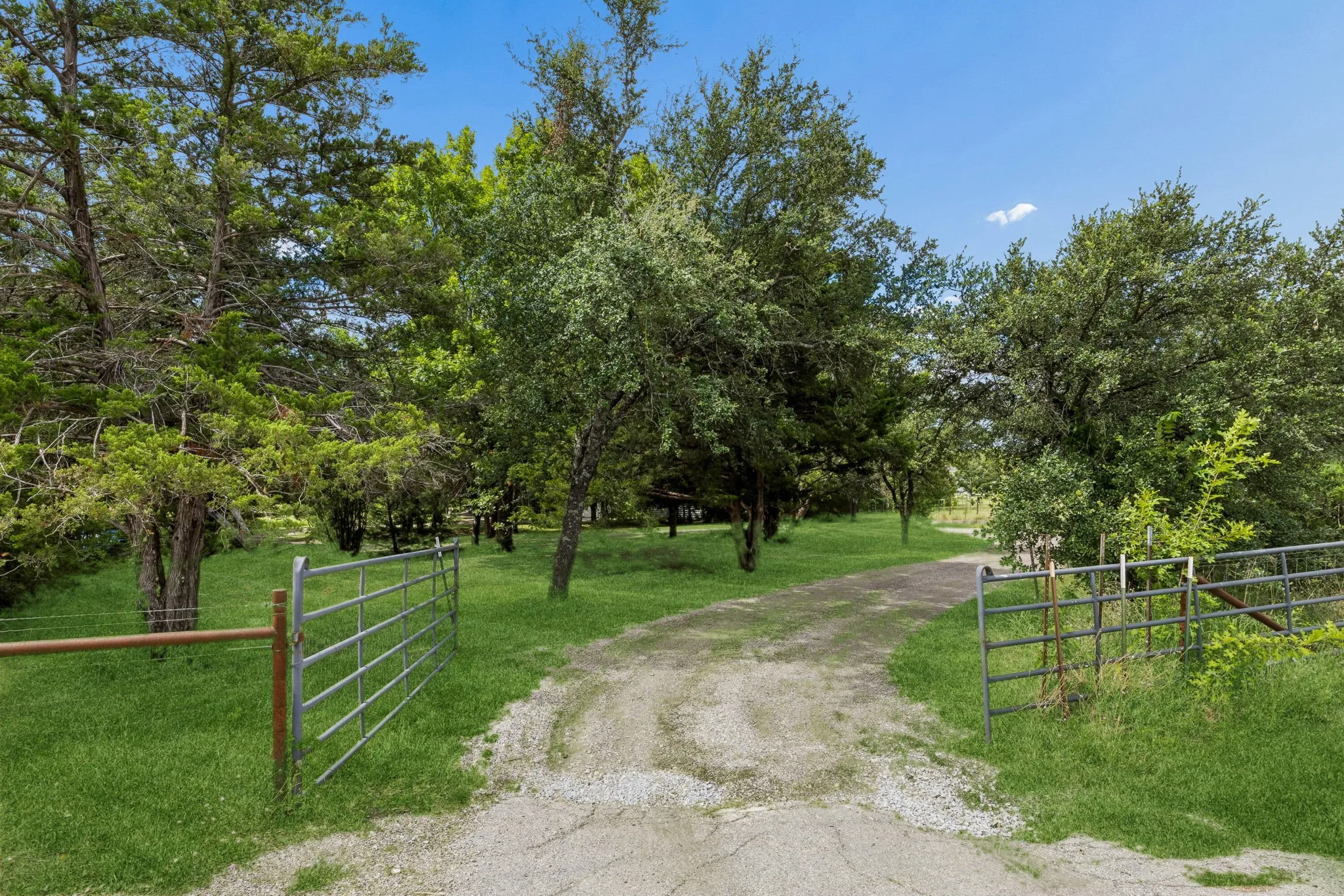 Private and gated entrance set back from the road for privacy. Follow the gravel road surrounded by trees to your new​​‌​​​​‌​​‌‌​‌‌​​​‌‌​‌​‌​‌​​​‌​​ home!