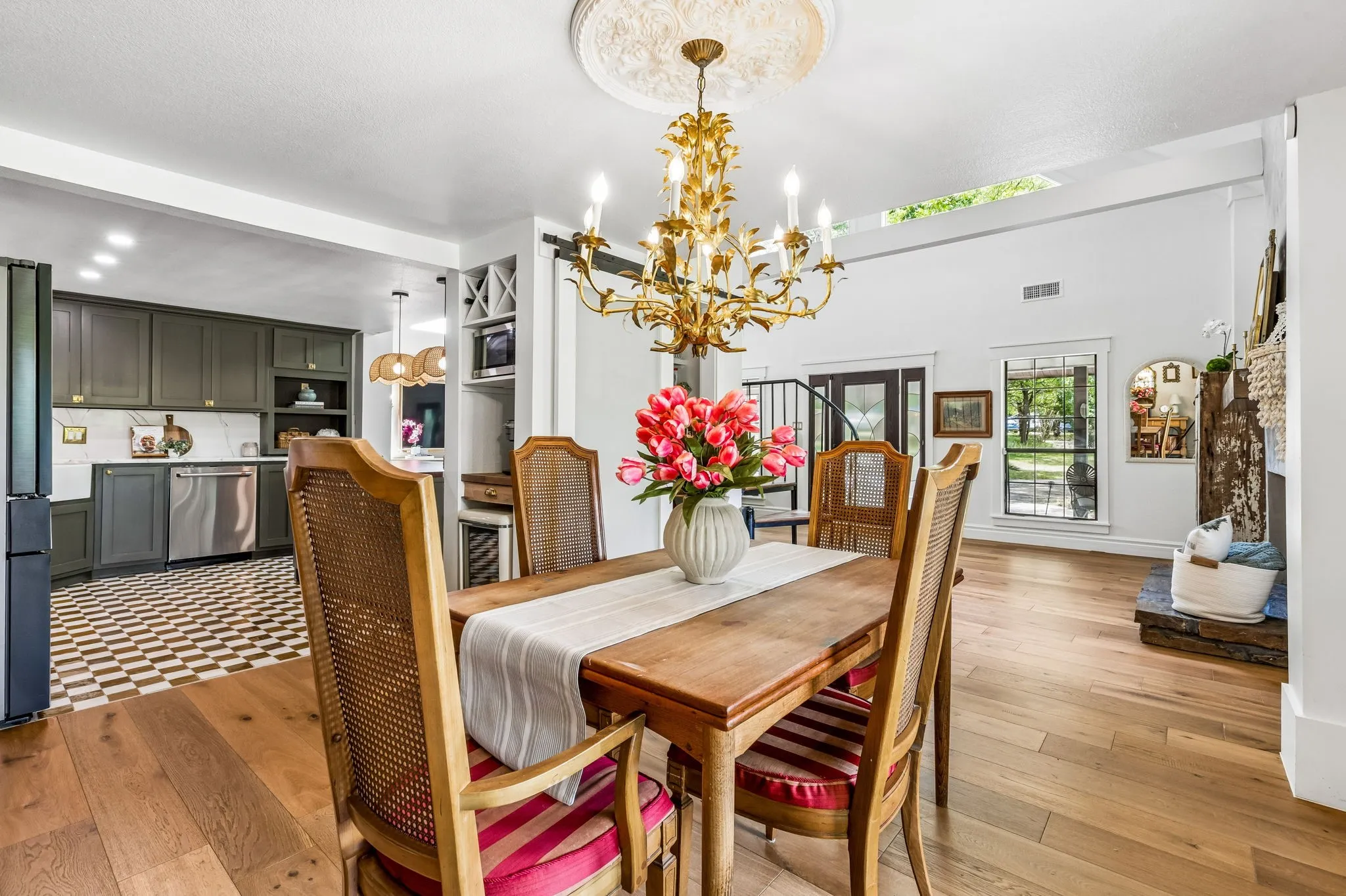Natural light floods the dining and kitchen area