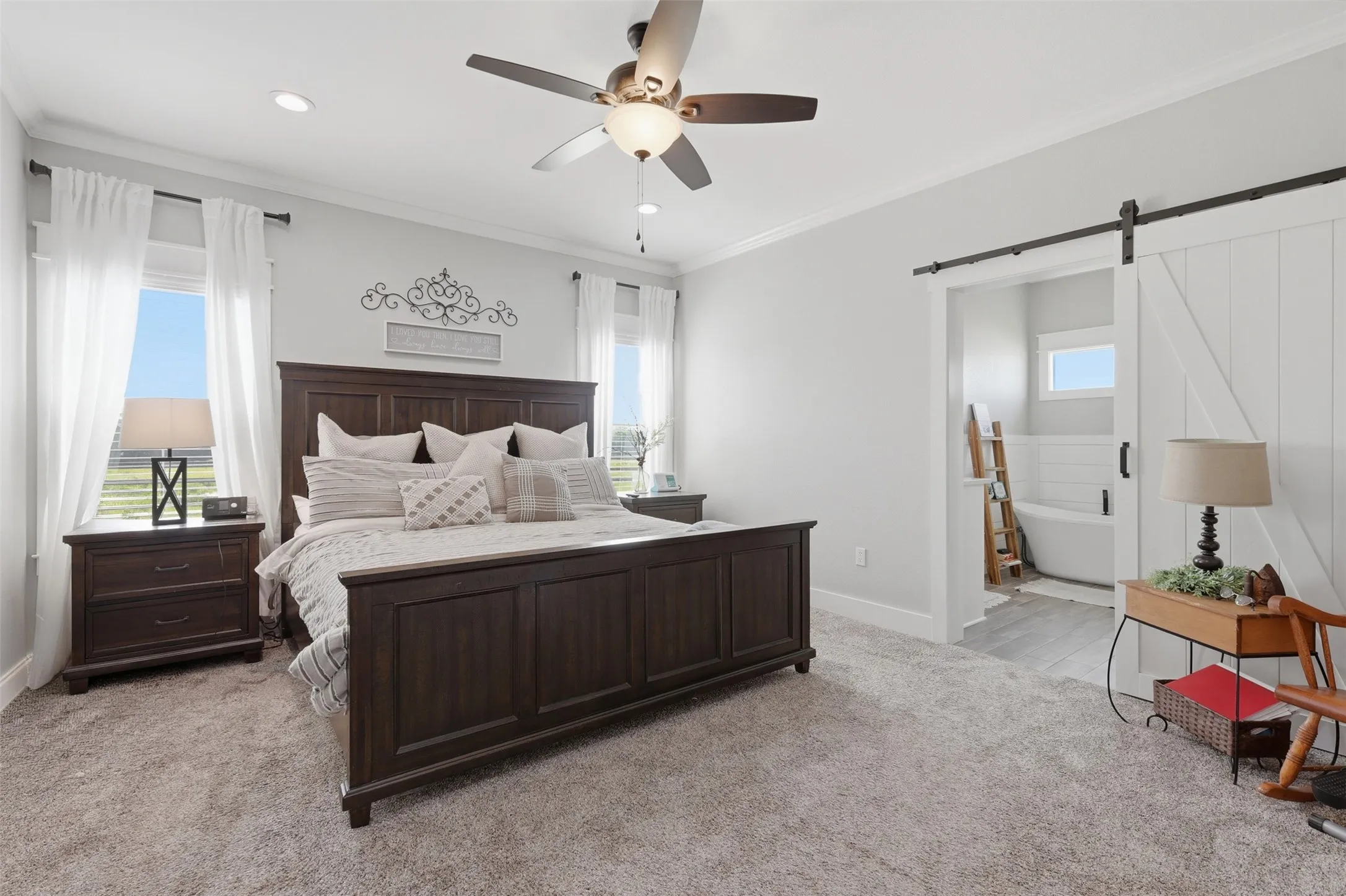 Carpeted bedroom featuring a ceiling fan with integrated lighting, recessed lighting, and crown molding