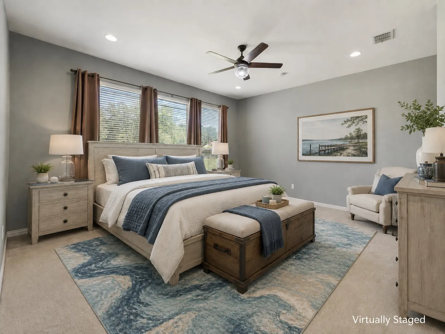 Virtually staged primary suite showcases a calm lake-inspired retreat with soft blues and modern farmhouse style.