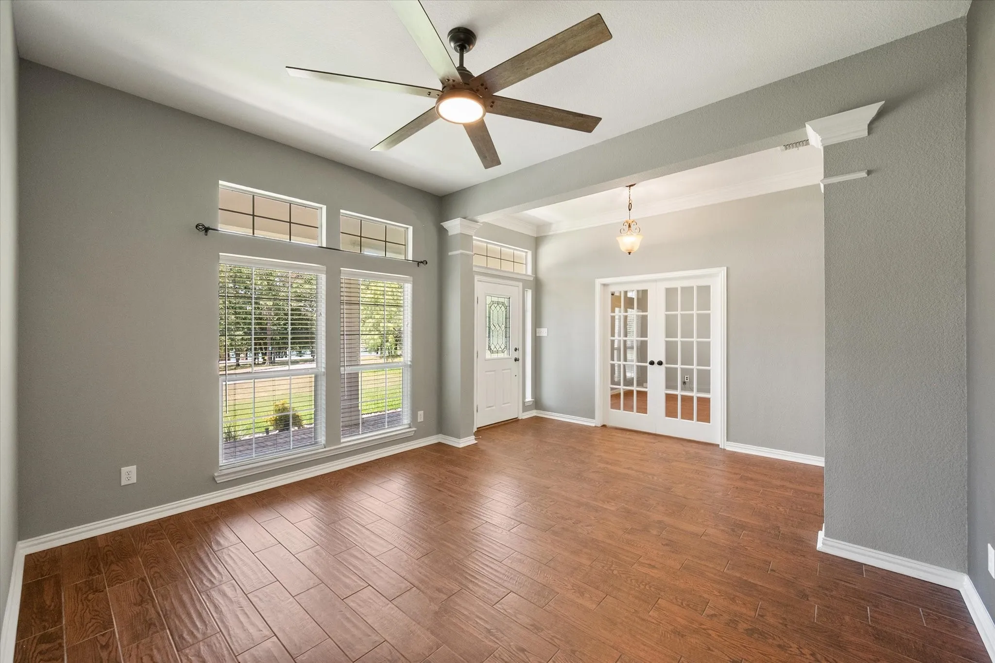 Spacious front sitting room offers natural light and flexible use near the home’s main entry.