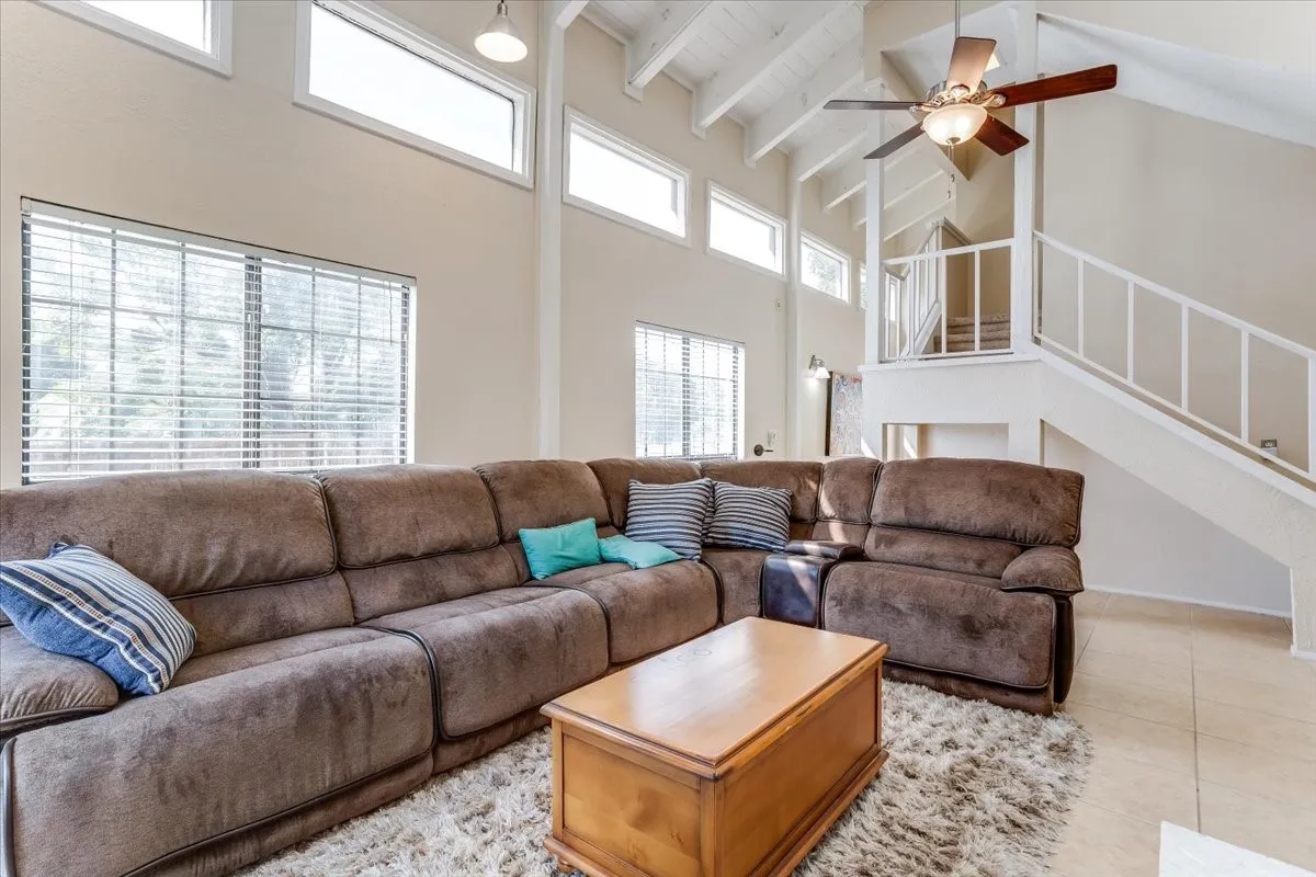 Soaring ceilings and tons of light in this end unit