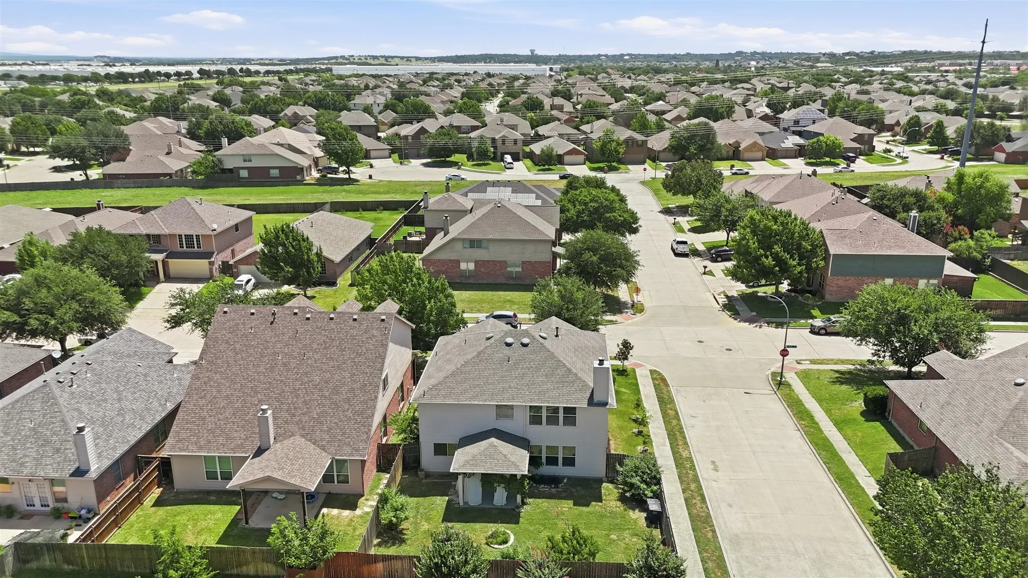 Aerial perspective showcasing a residential neighborhood with a variety of single-family homes
