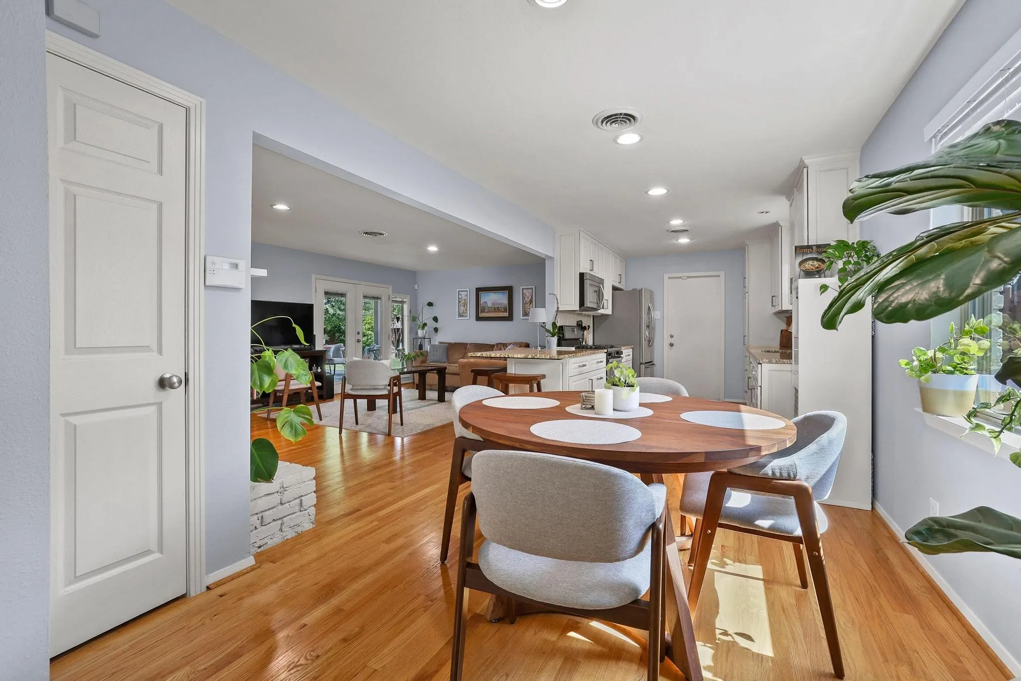 Just beyond the living room, the breakfast area creates another gathering space for meals and conversation.