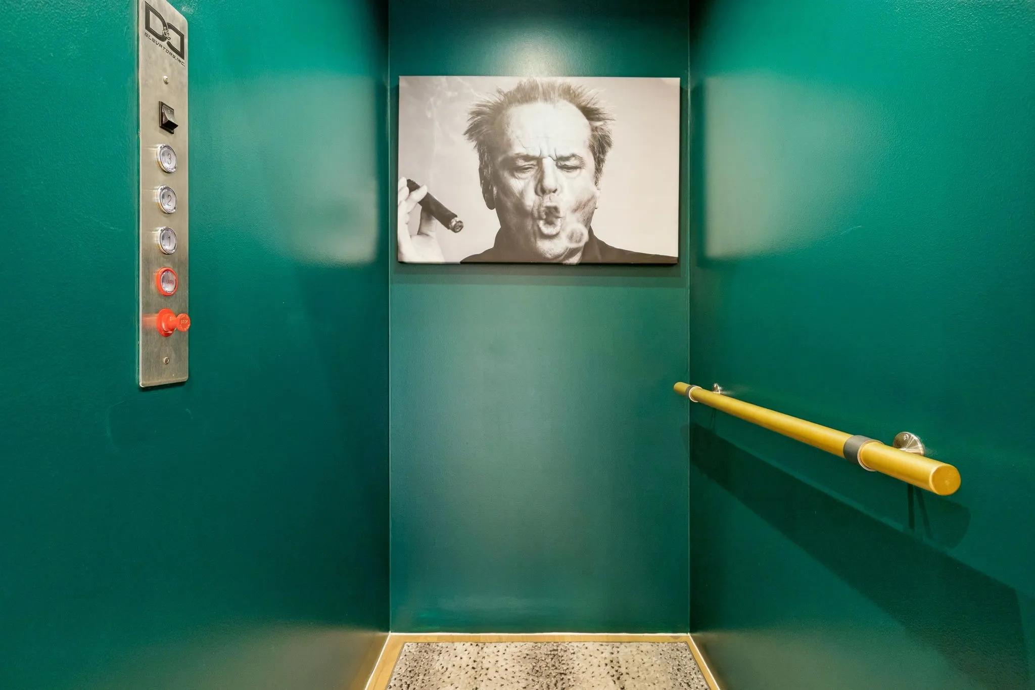 Elevator with custom rail, paint, and rug