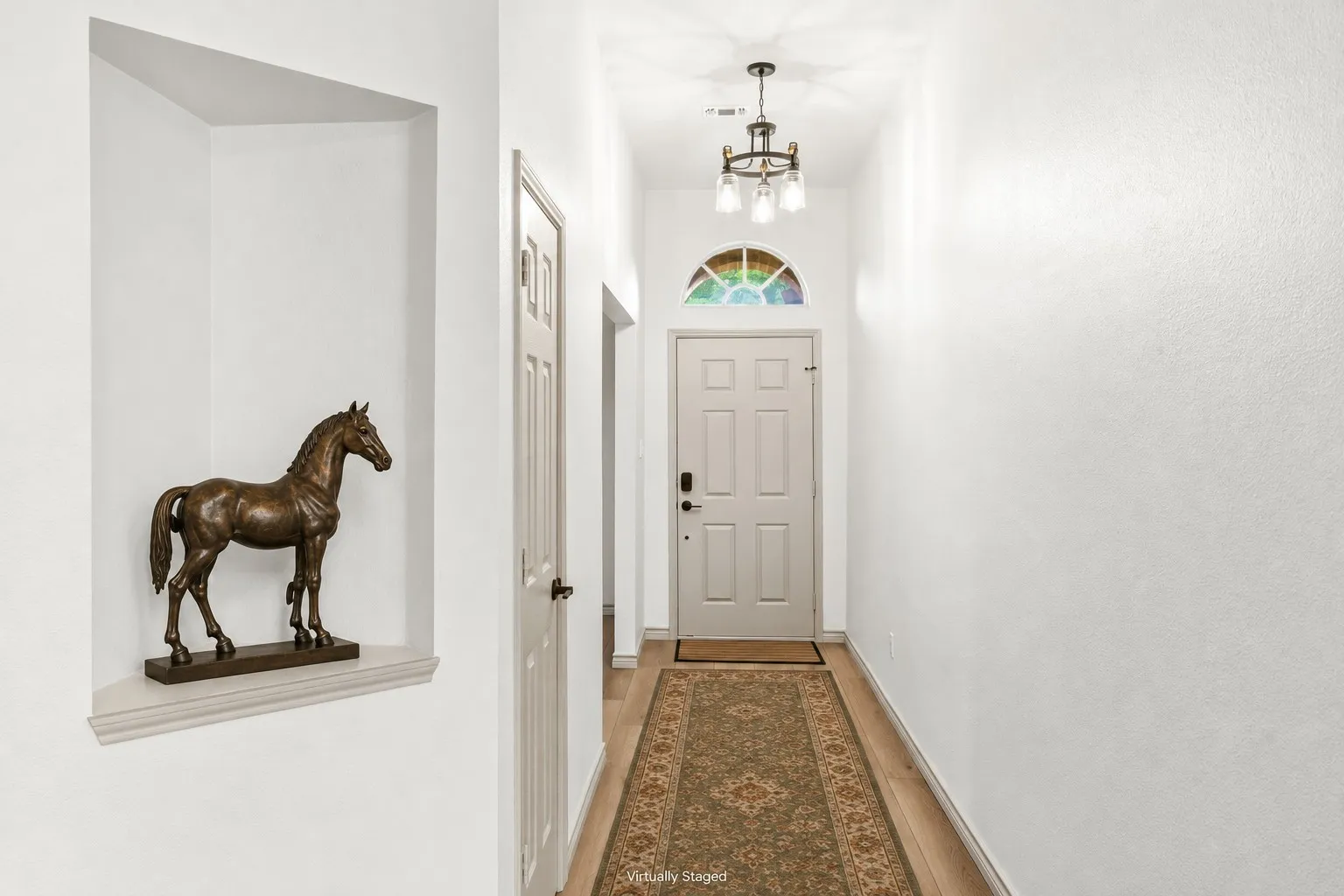 This home offers a welcoming foyer. The office or formal dining room is just to the left of the front door.