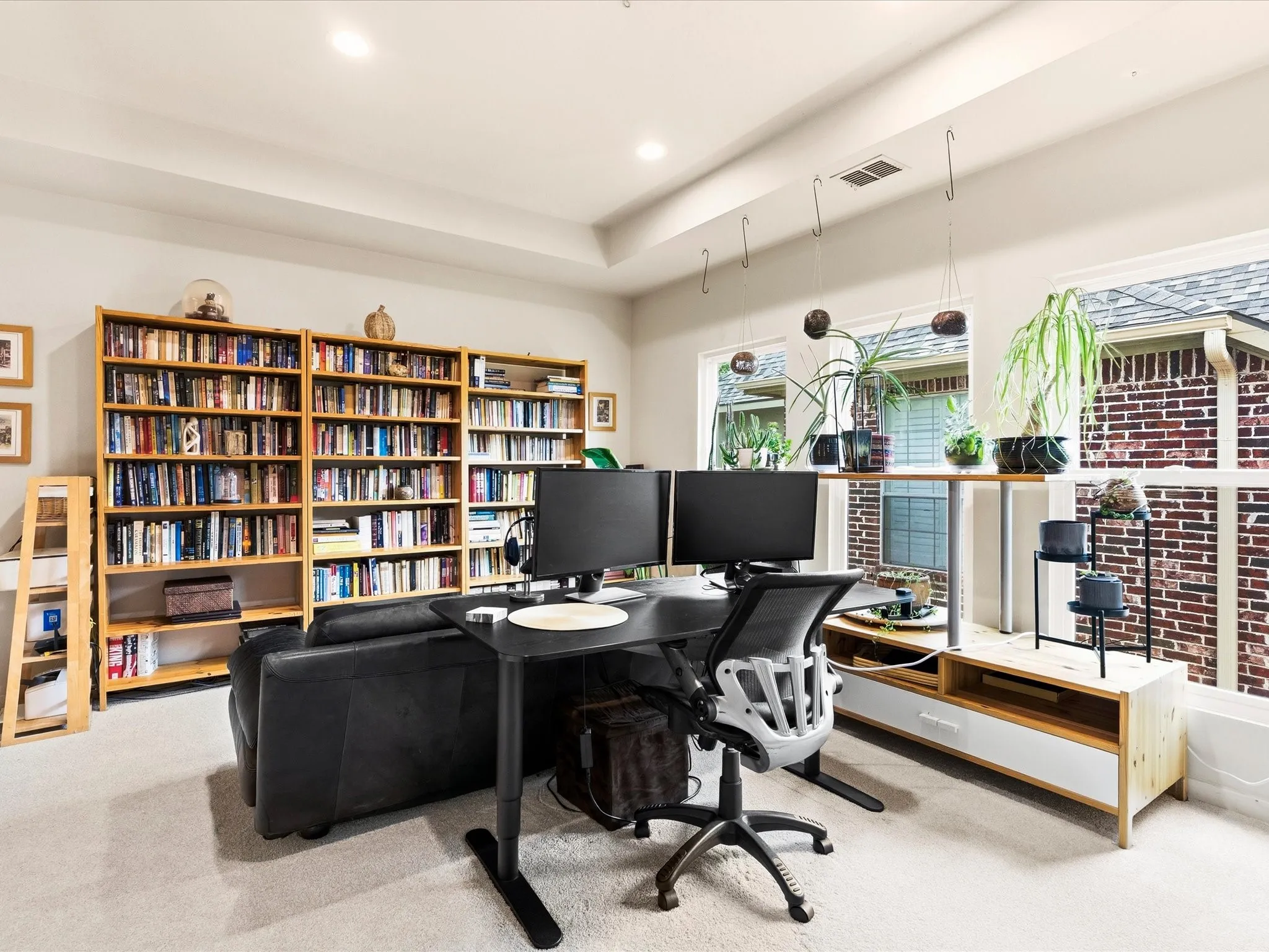 Game room eaturing a tray ceiling, recessed lighting, and light-colored carpeting
