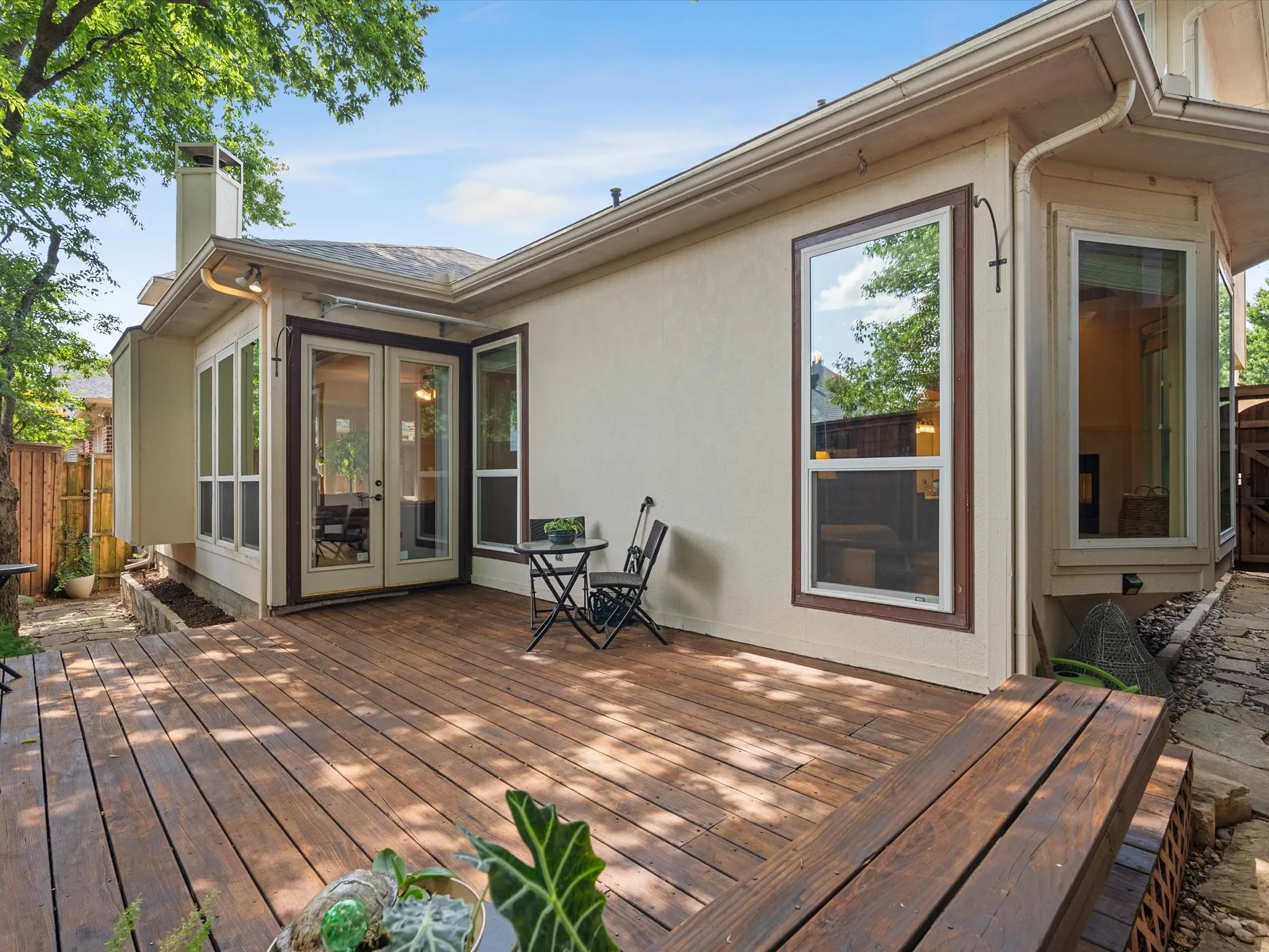 Expansive wood-finish deck featuring integrated bench seating