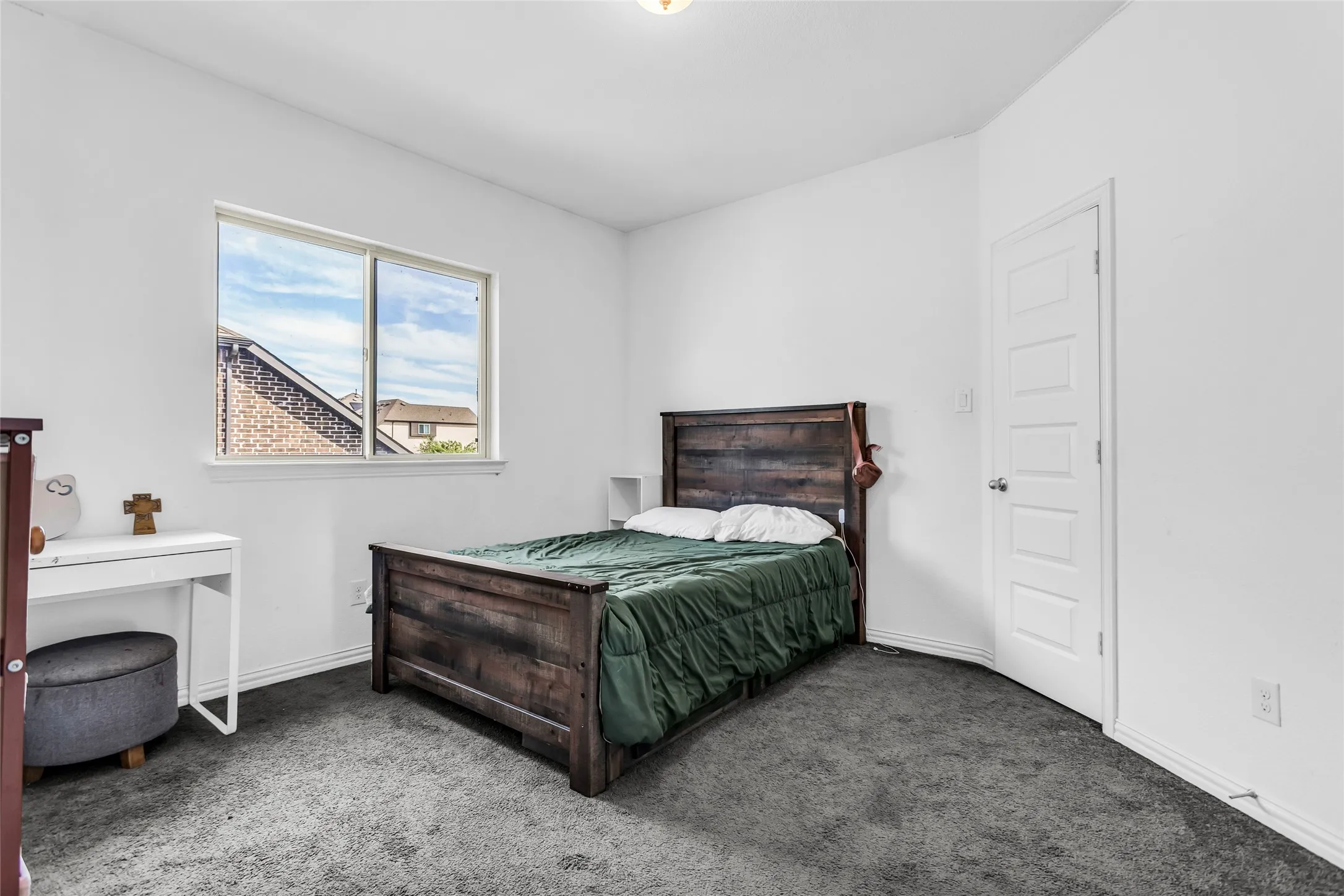 Bedroom with carpet and baseboards
