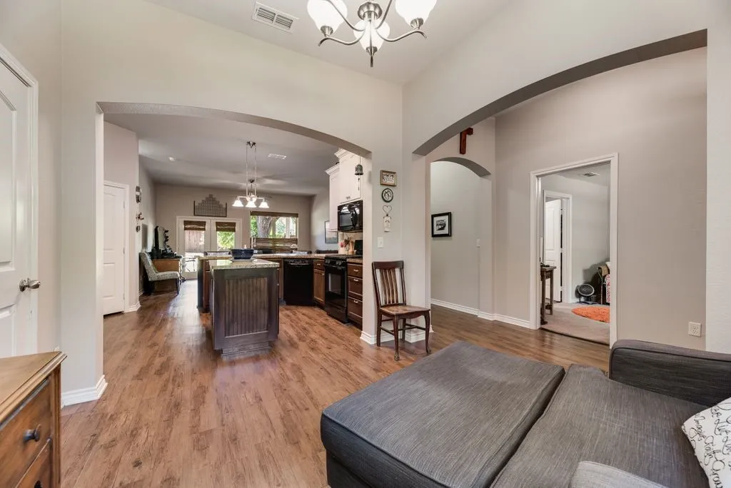 Formal dining area that overlooks kitchen and breakfast bar