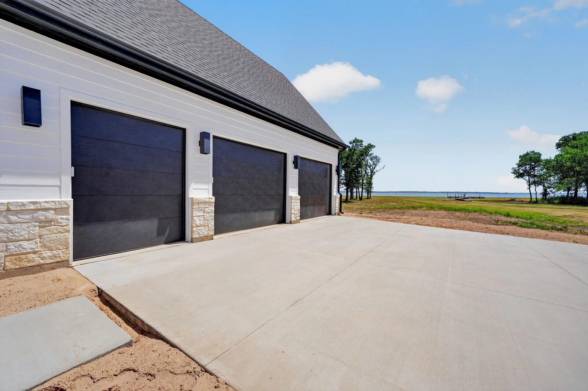 Oversized 2.5 car garage with dedicated golf cart bay.