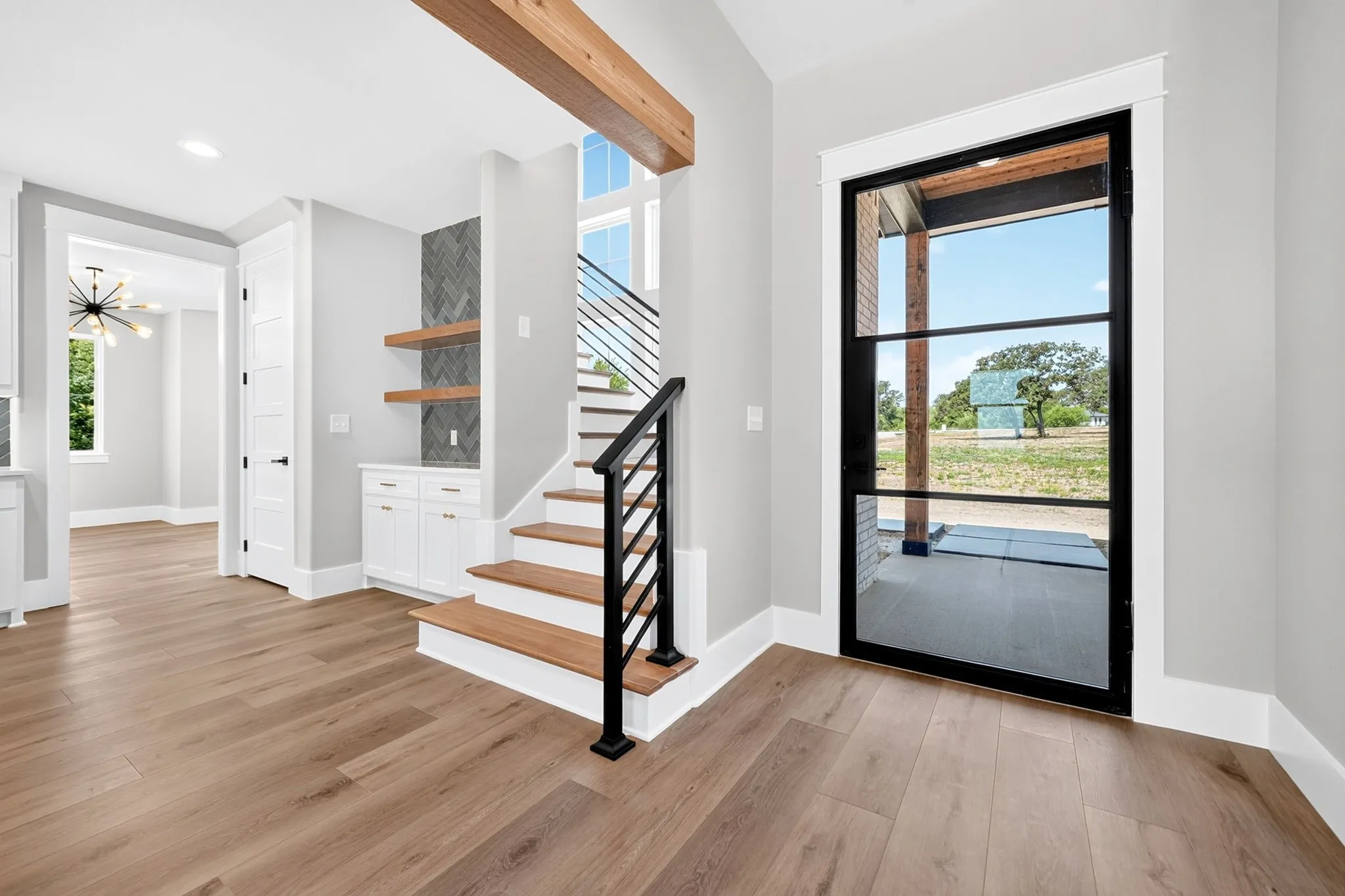 A striking pivot style glass door that makes a bold first impression.