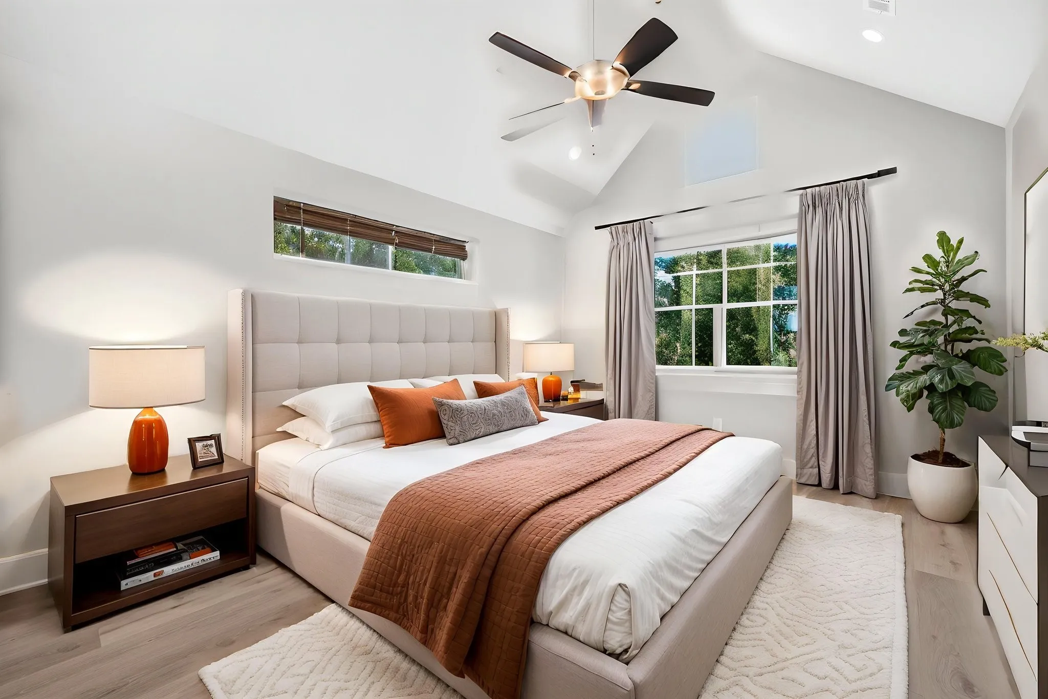 Master bedroom, features a timber beam, cathedral ceiling, and large windows with a spectacular view of the lake.