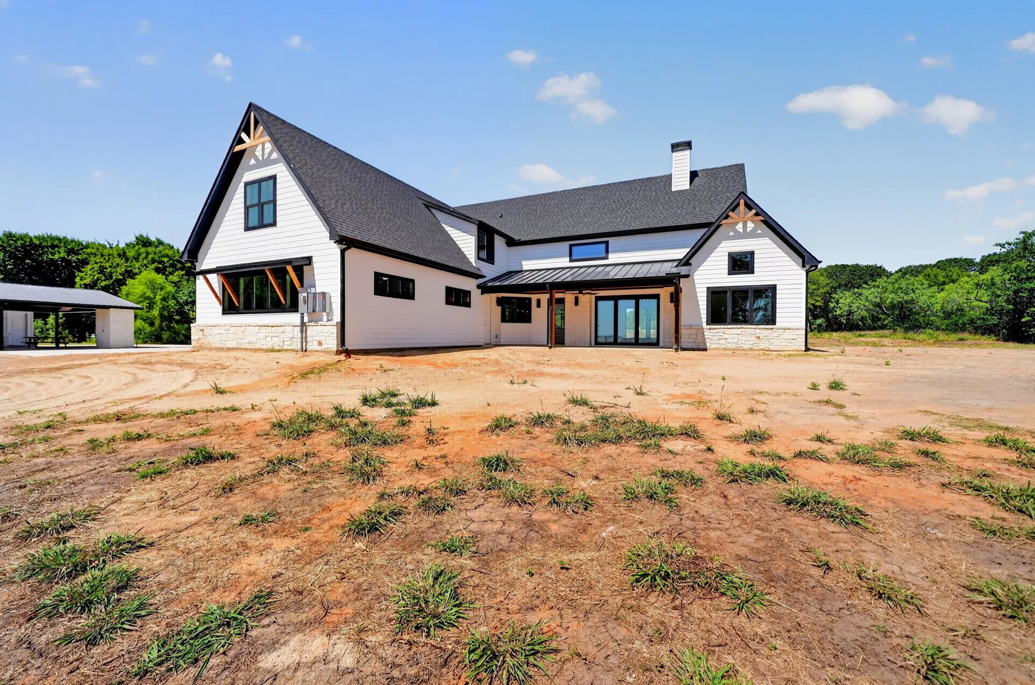 Stunning rear exterior view showcasing the walls of windows.