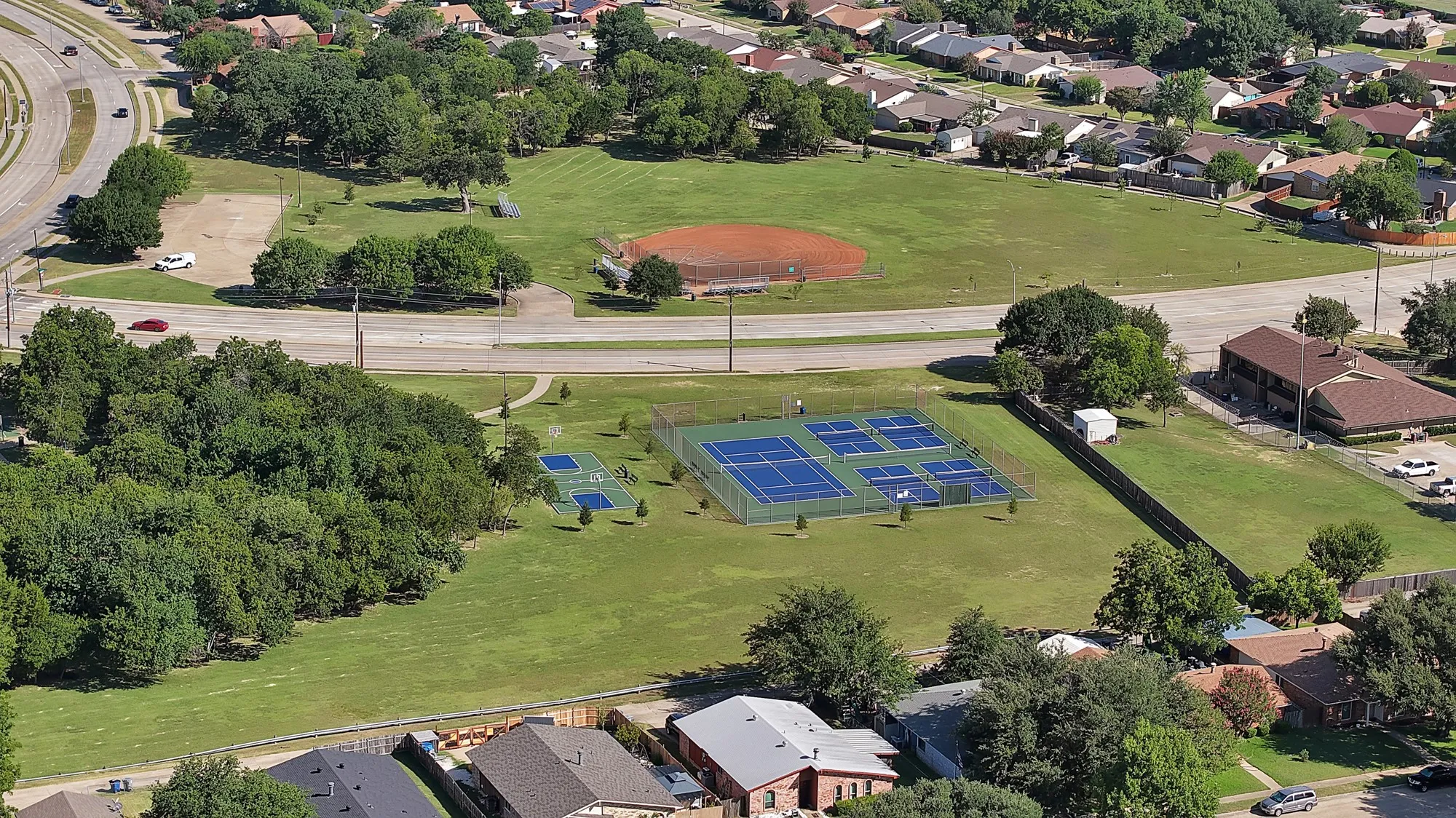 Aerial perspective showcasing a community park with multiple recreational facilities