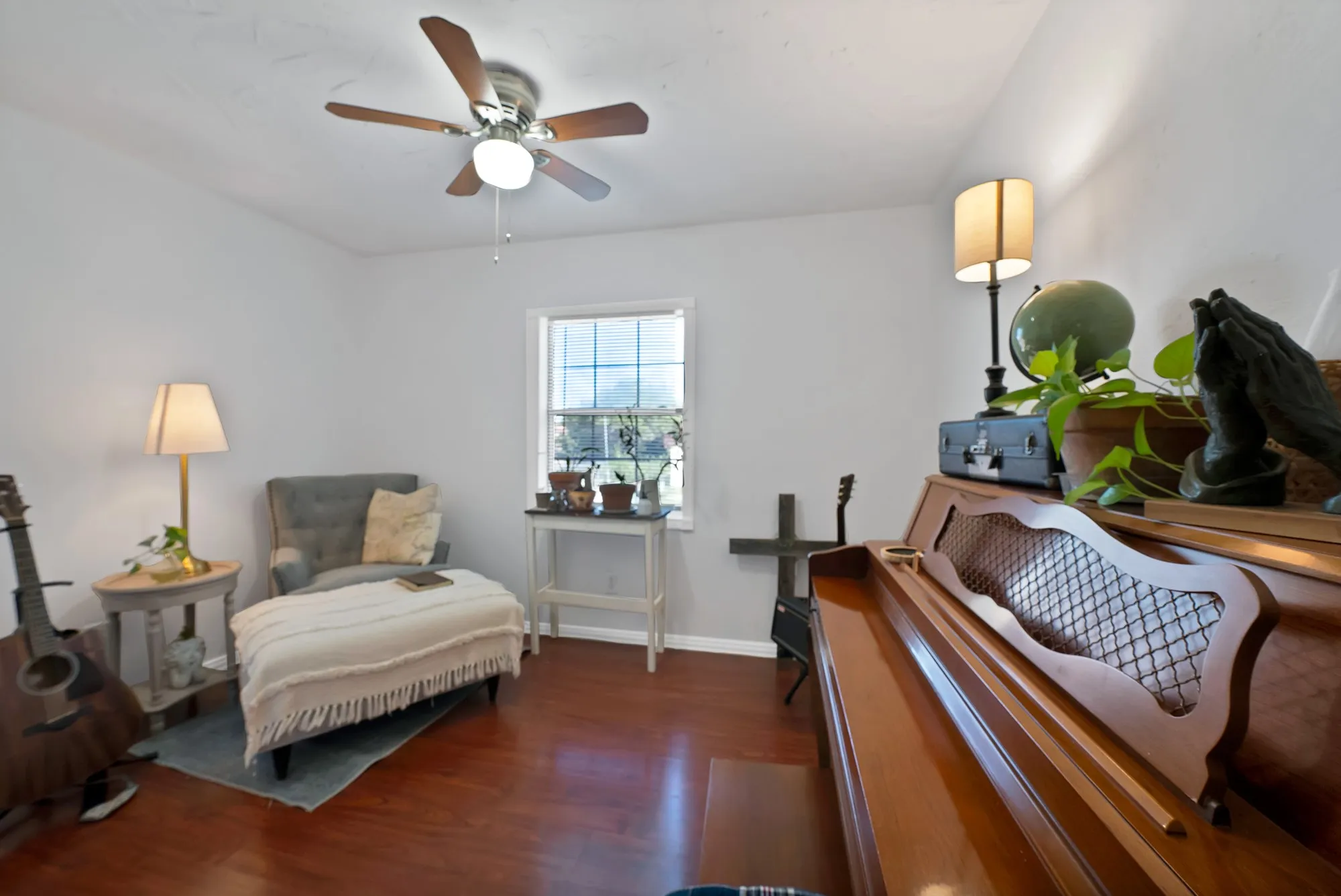 Bright interior space featuring wood-finish flooring and white walls