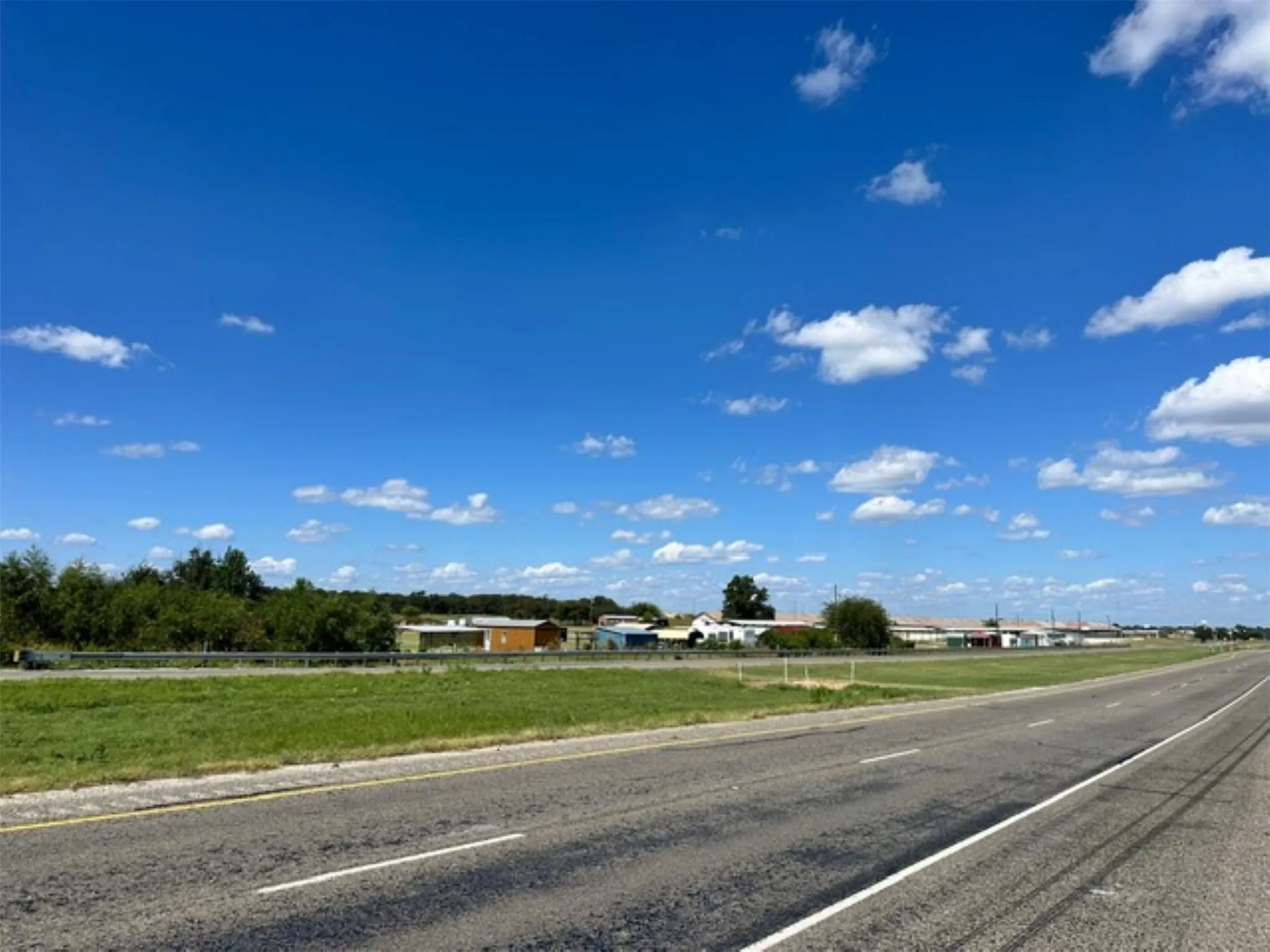 View of other end of the property  and those buildings. Photo taken from across from HWY 377