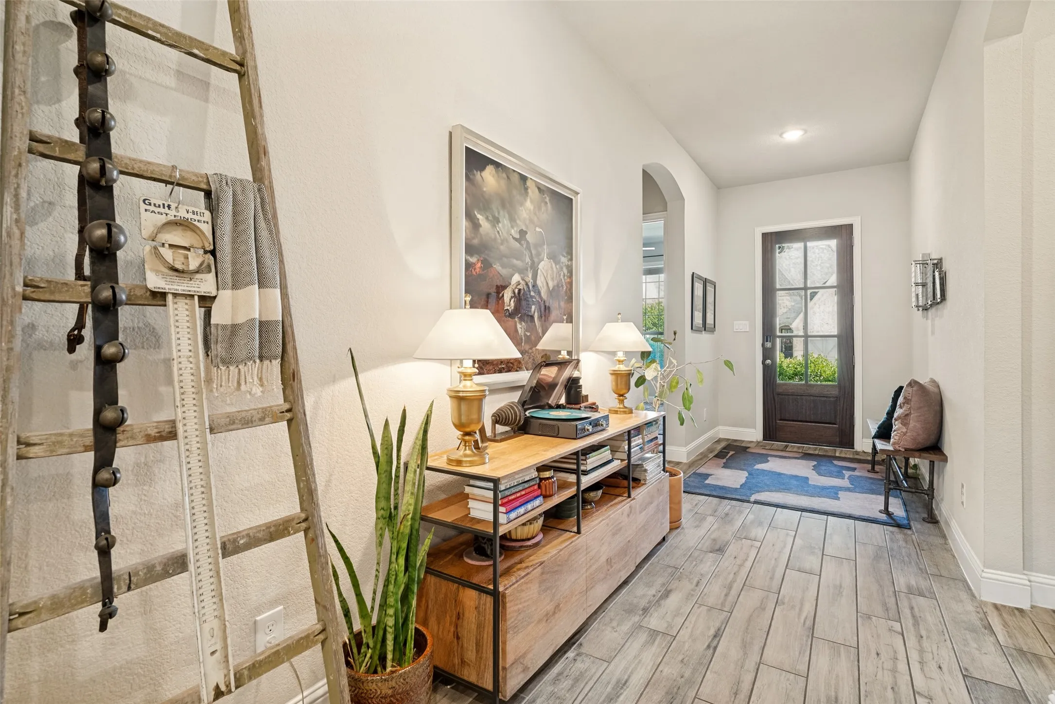 Entryway featuring wood-finish flooring and light-toned walls