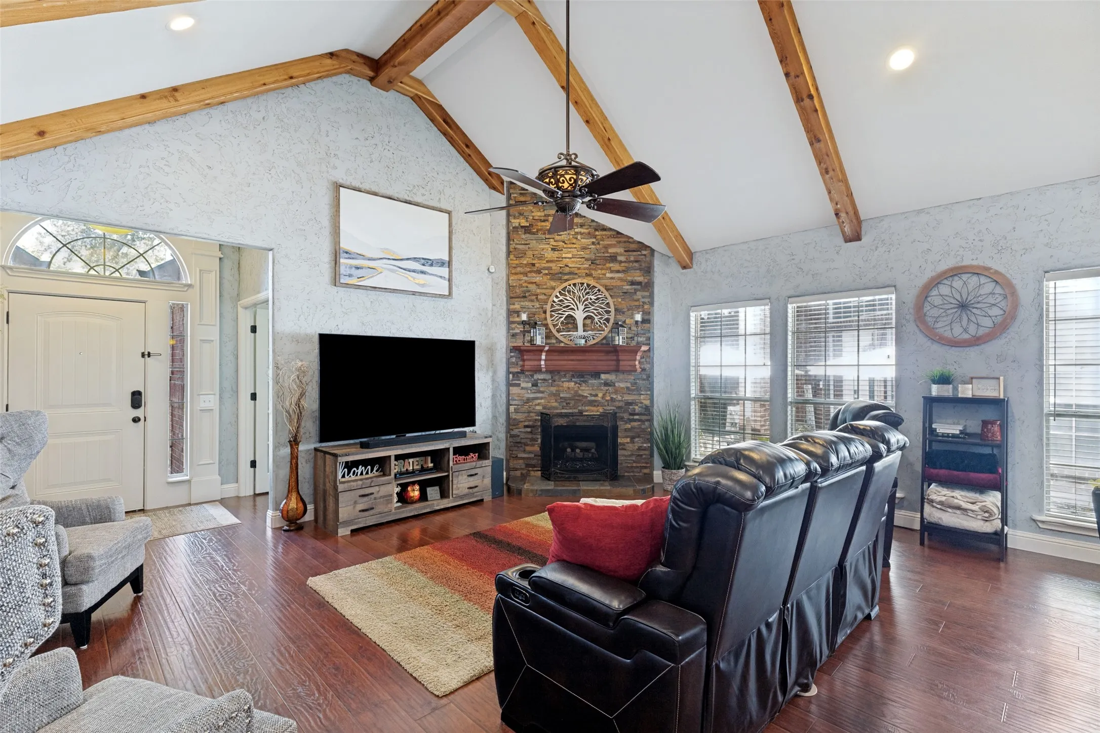 Vaulted ceiling featuring exposed wood beams