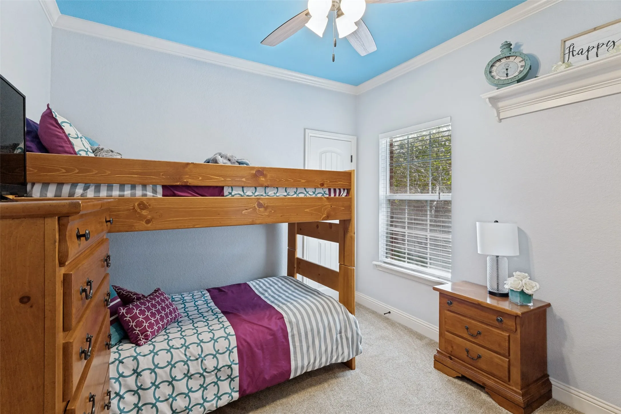 2nd bedroom featuring carpet flooring, a window with blinds, a white ceiling fan,