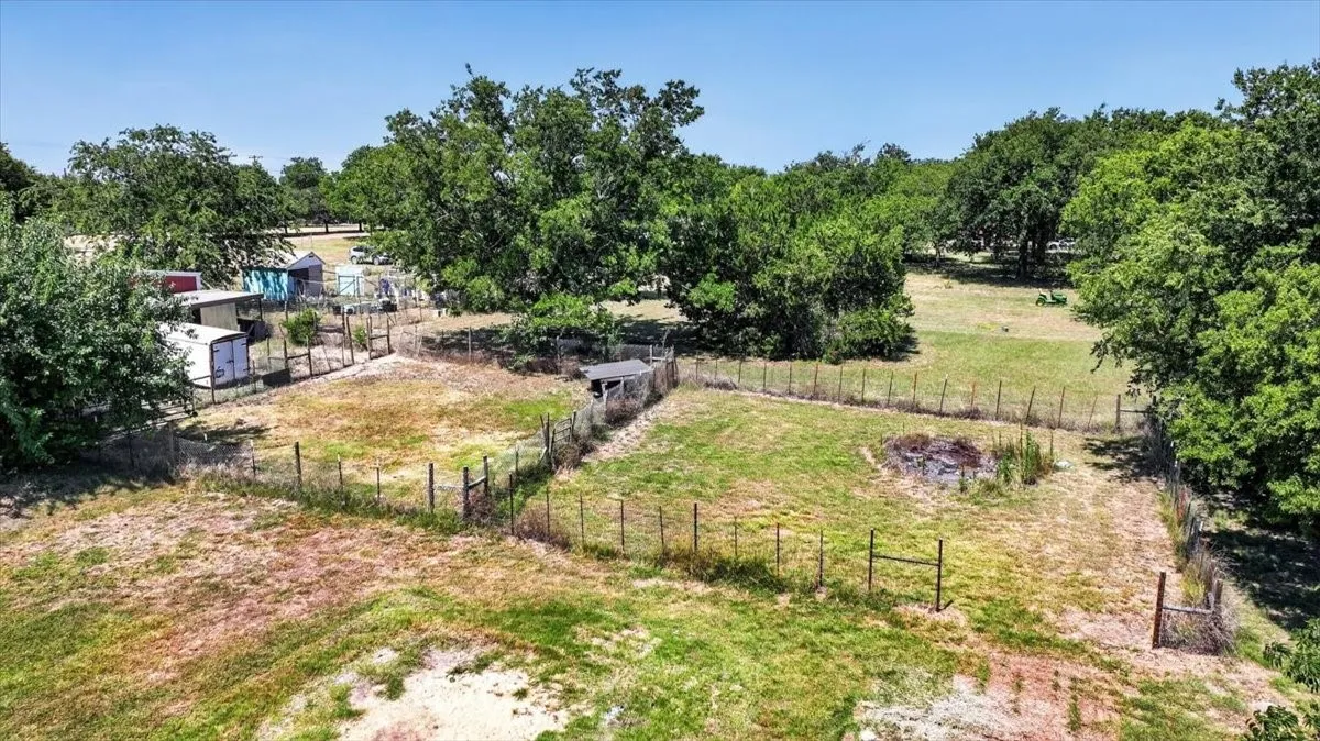 Two fenced utility areas with room for outdoor use, animals, or projects