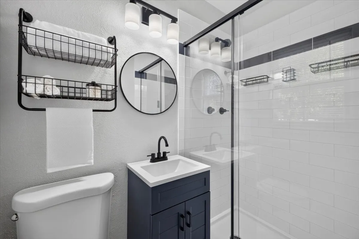 Renovated primary bathroom with walk-in shower and updated vanity