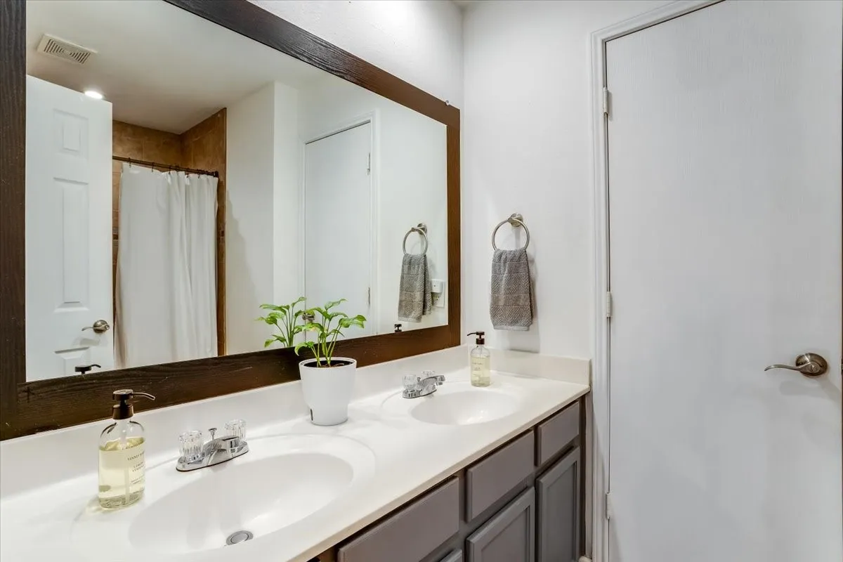 Dual vanity with undermount sinks and chrome fixtures