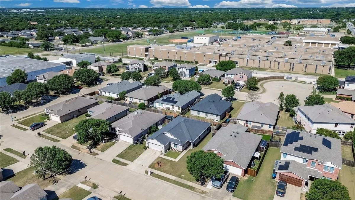 Residential neighborhood featuring single-story and two-story homes with shingled roofs