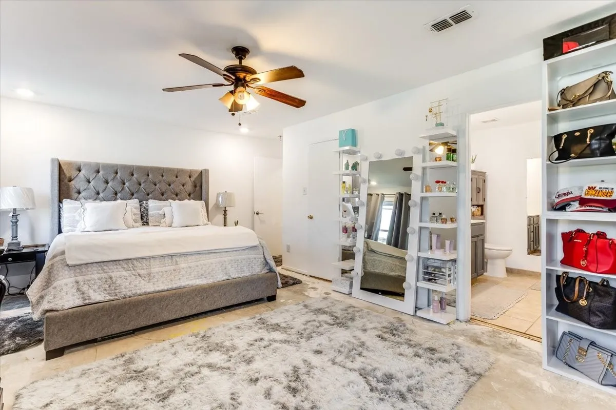 Spacious room featuring a ceiling fan with light fixture, recessed lighting, and tile flooring