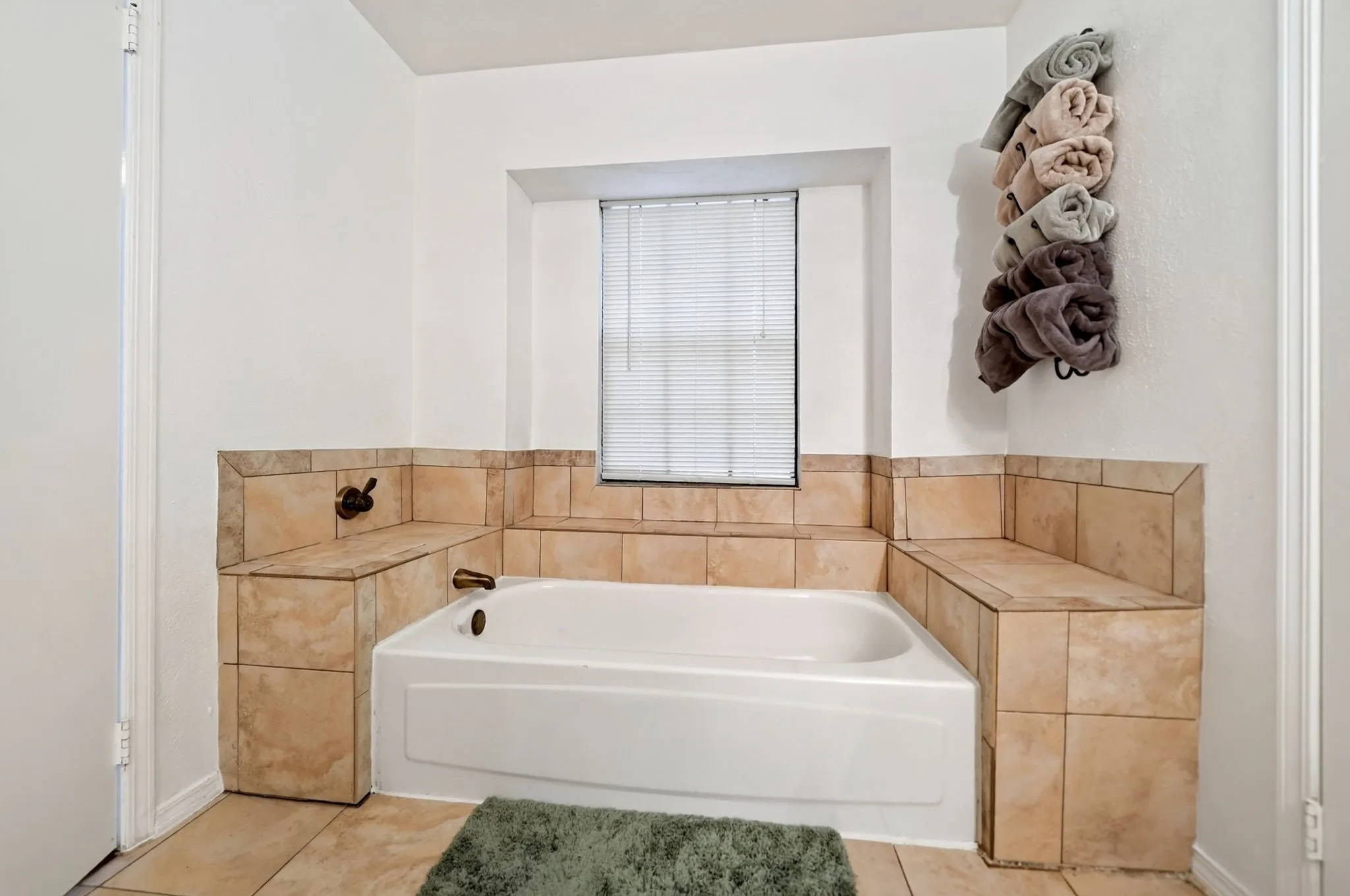 Primary Bathroom: Designed with a dedicated tub space for a clean, spa-like feel.