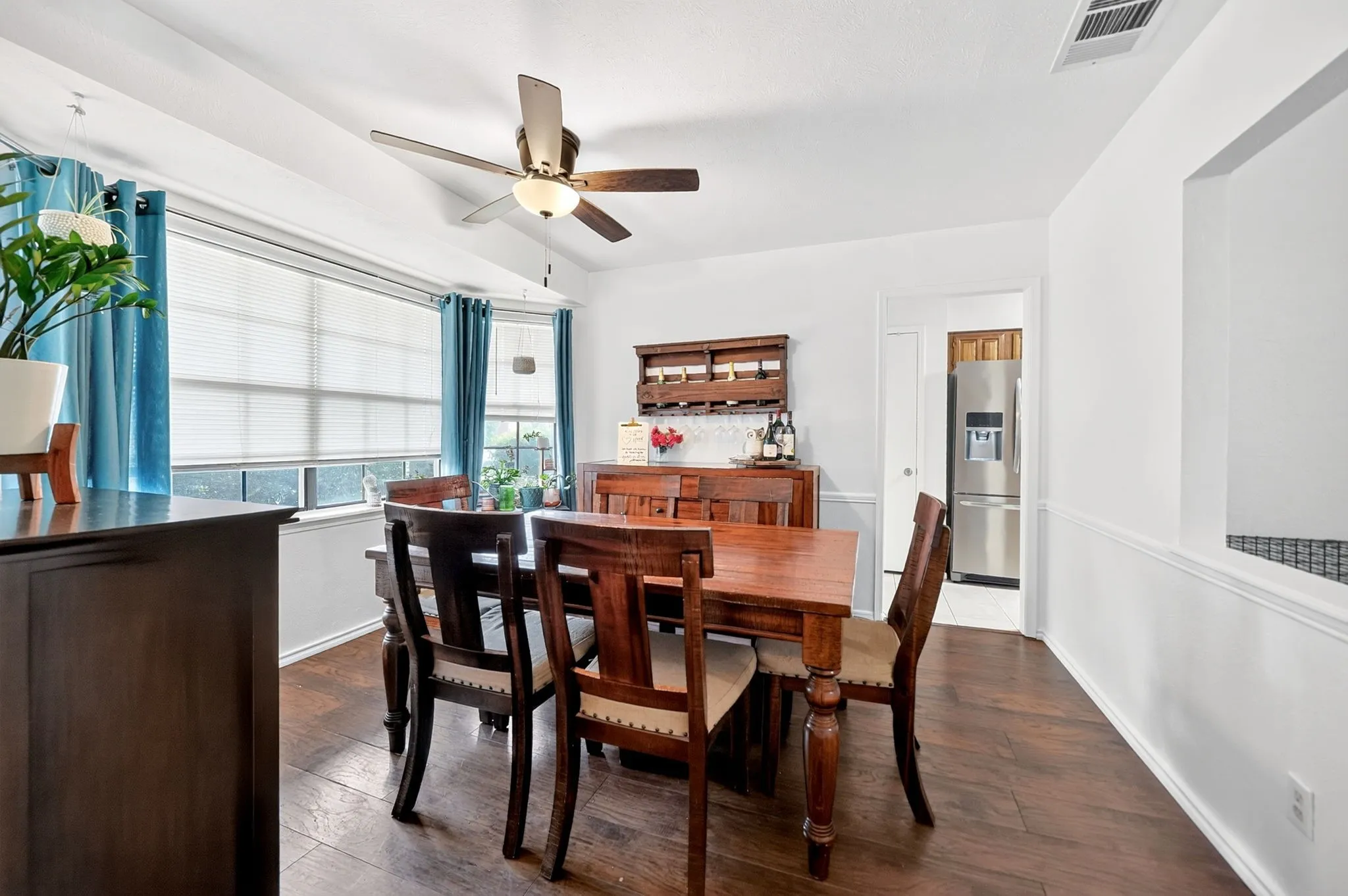 Dinning Area: A grand, open room with a large bay window.