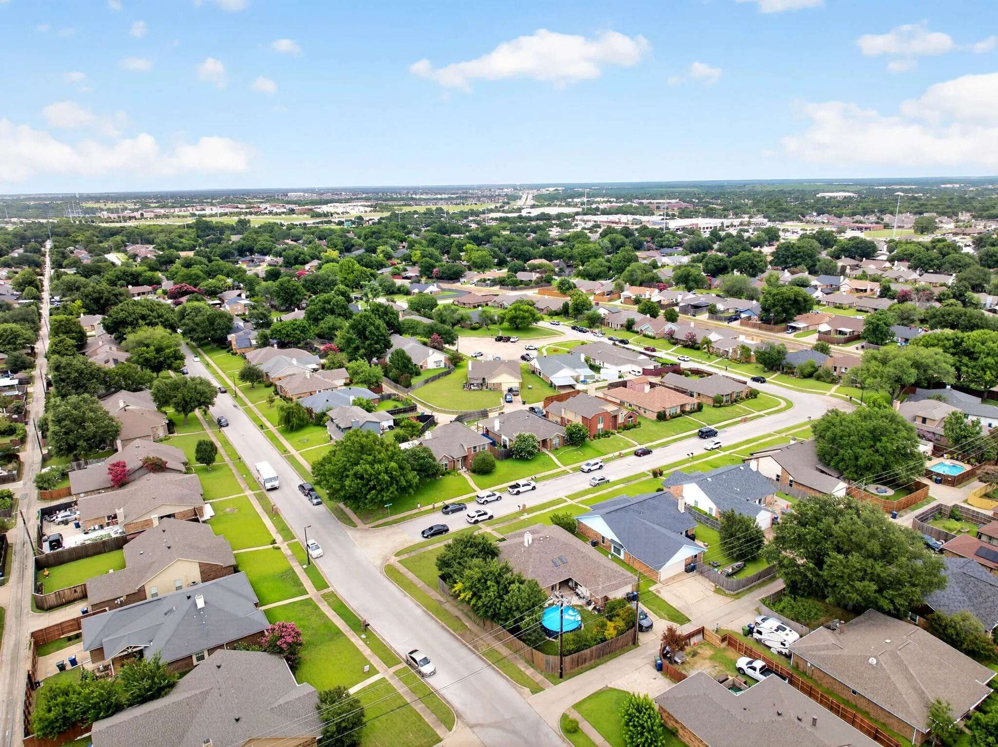 Aerial view of the neighborhood. Princewood Drive seamlessly connects directly to Naaman School Road, offering residents quick access to both Highway 78 and the President George Bush Turnpike.