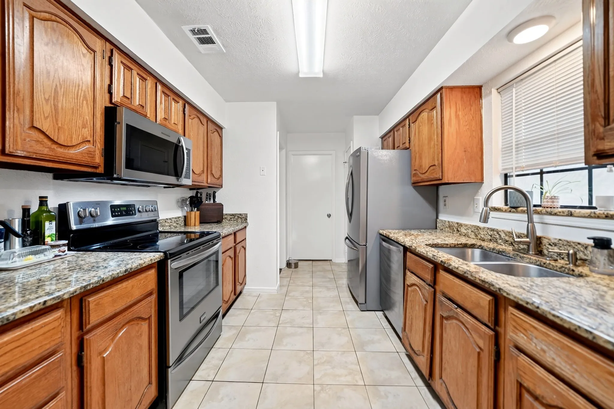 The kitchen features granite countertops.