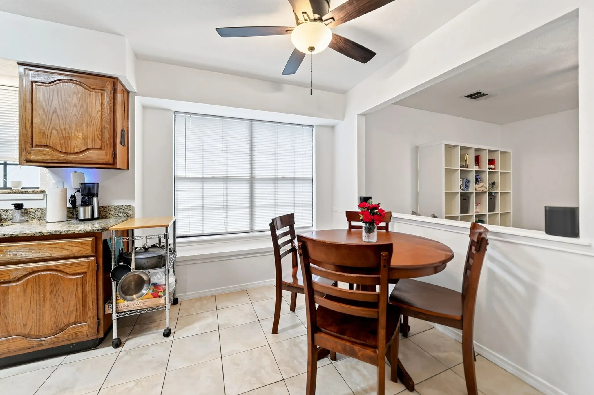 This cozy breakfast nook is anchored by an expansive window and custom bench seating.