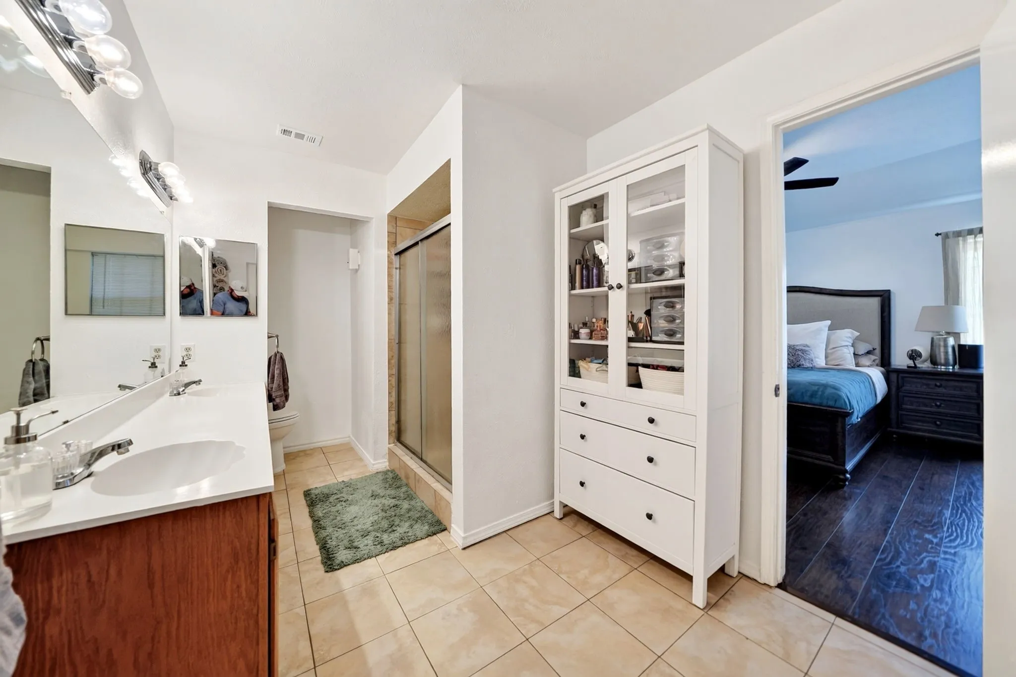 Primary Bathroom: Features a double vanity and a generous stand-alone shower.