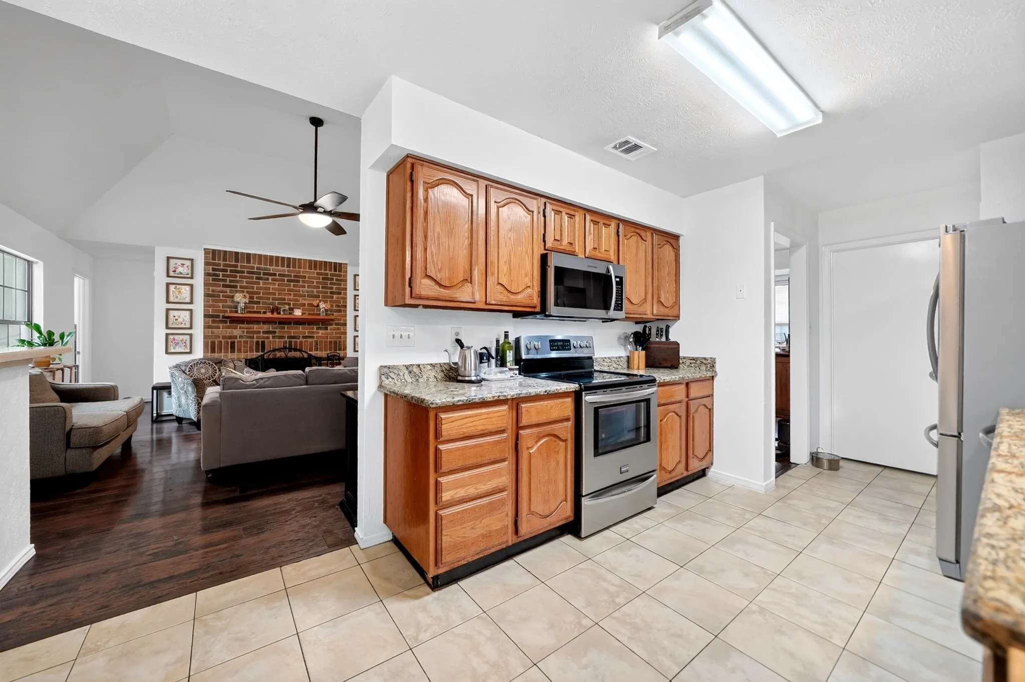 Dual-access kitchen layout perfectly positioned between the main living area and the formal dining room for optimal flow.