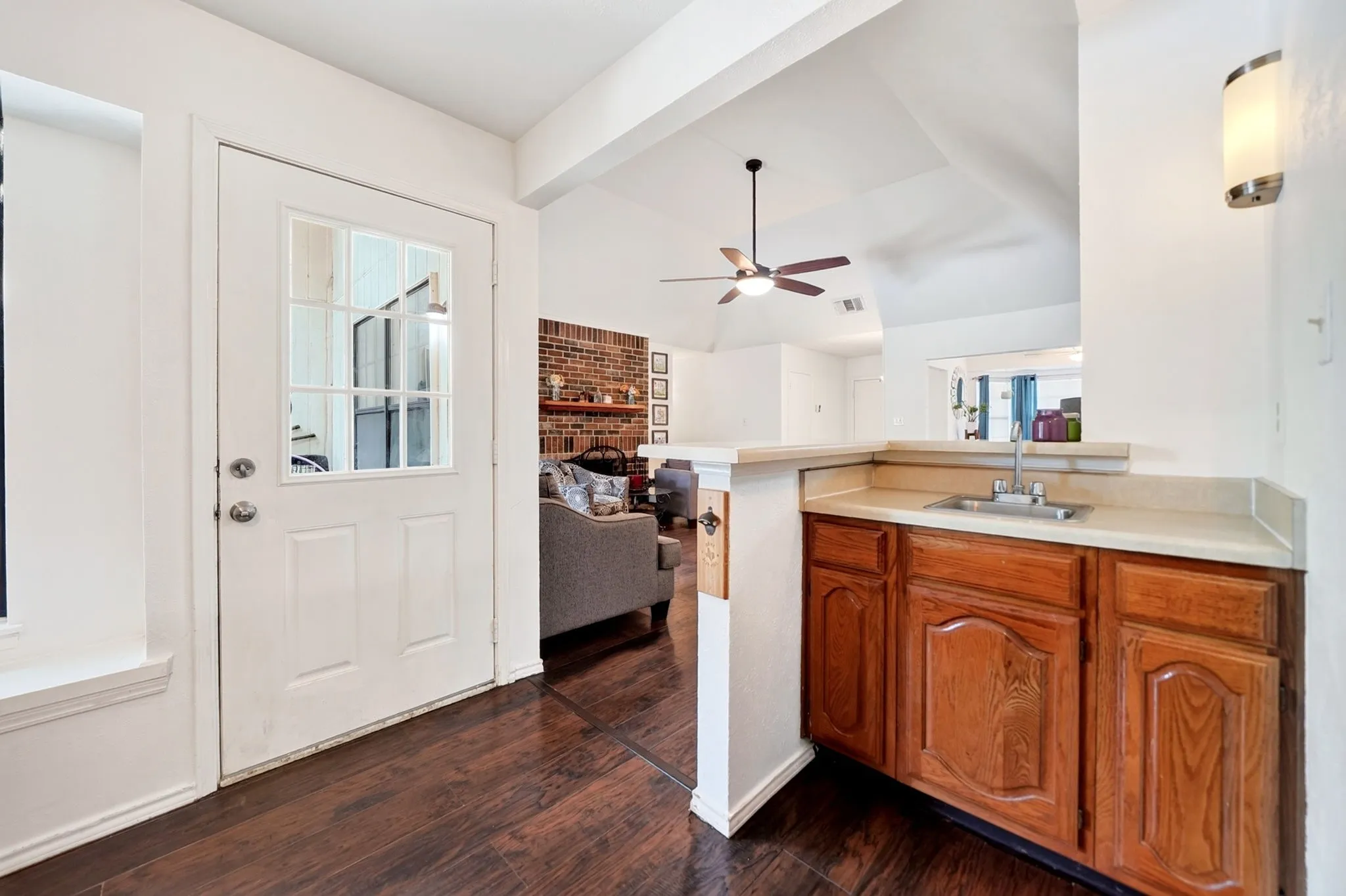 Freshly painted wet bar with direct patio door access.