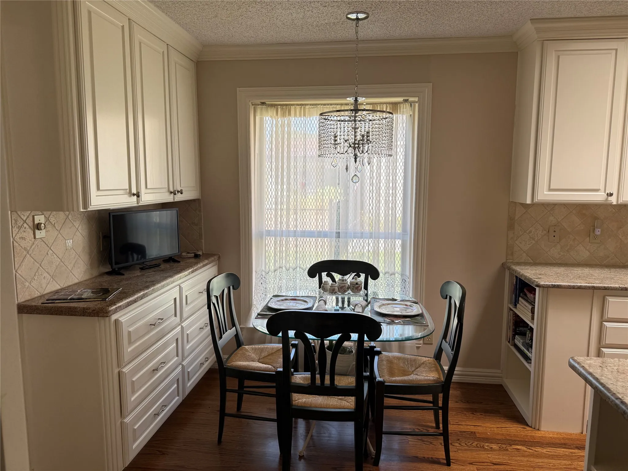 Bright breakfast nook with extra cabinets and storage