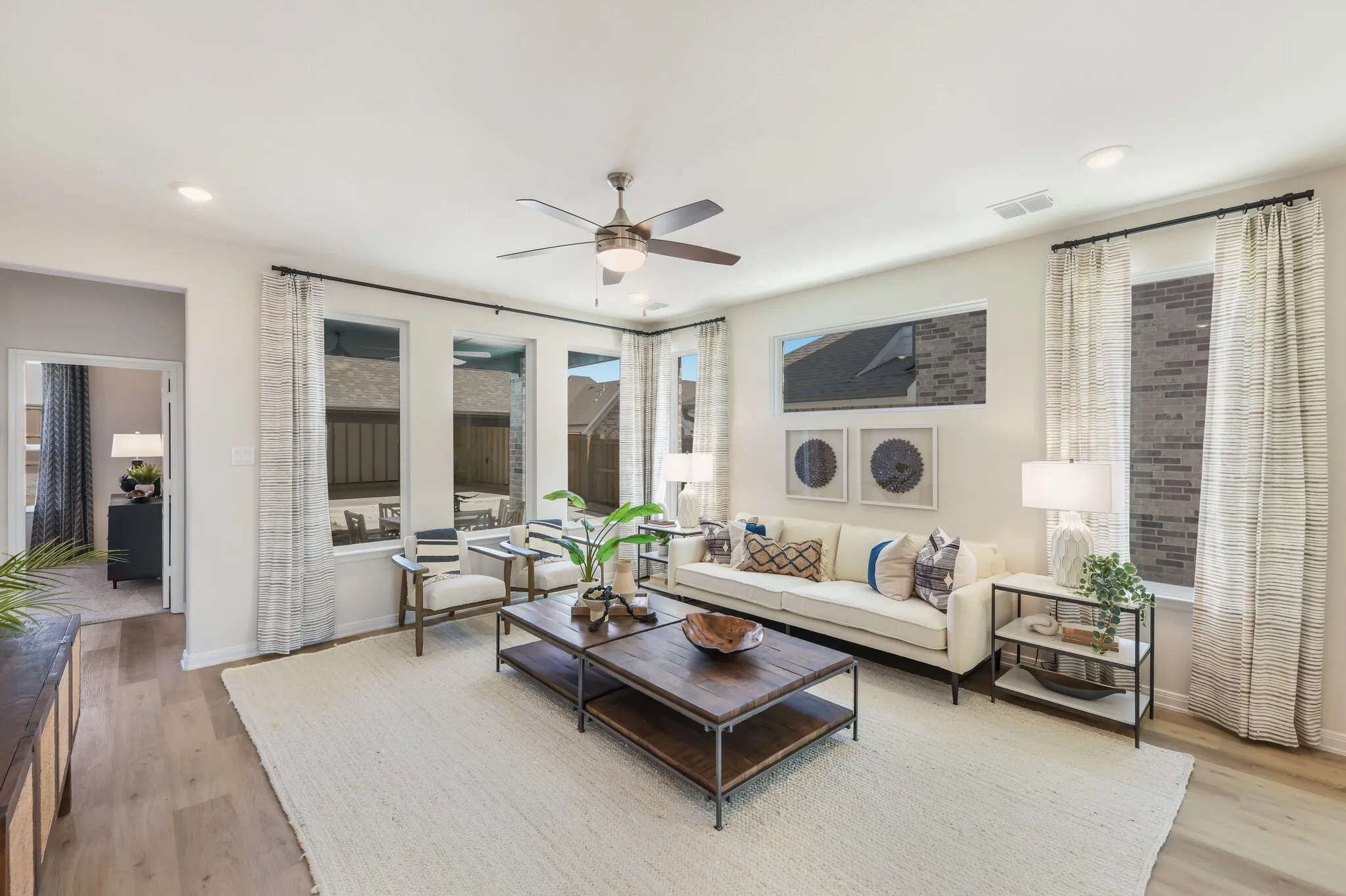 With a wall of windows looking out to your back yard, this family room offers a warm and inviting place to gather.