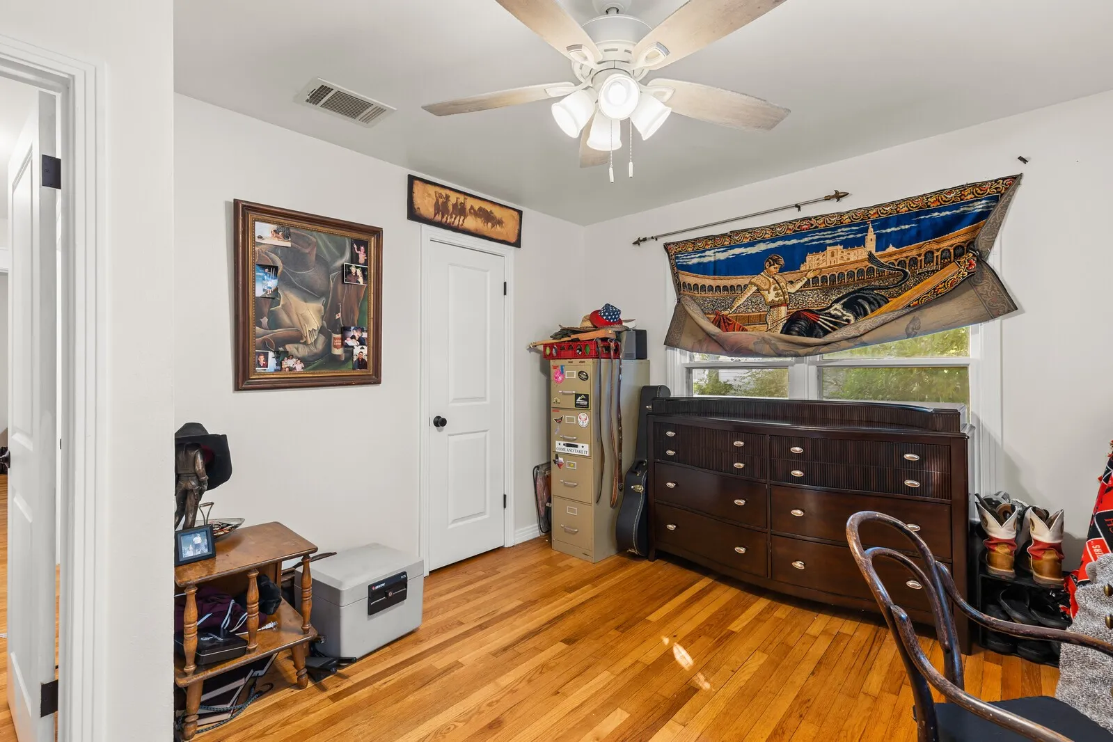 Wood-finish flooring with white walls and trim