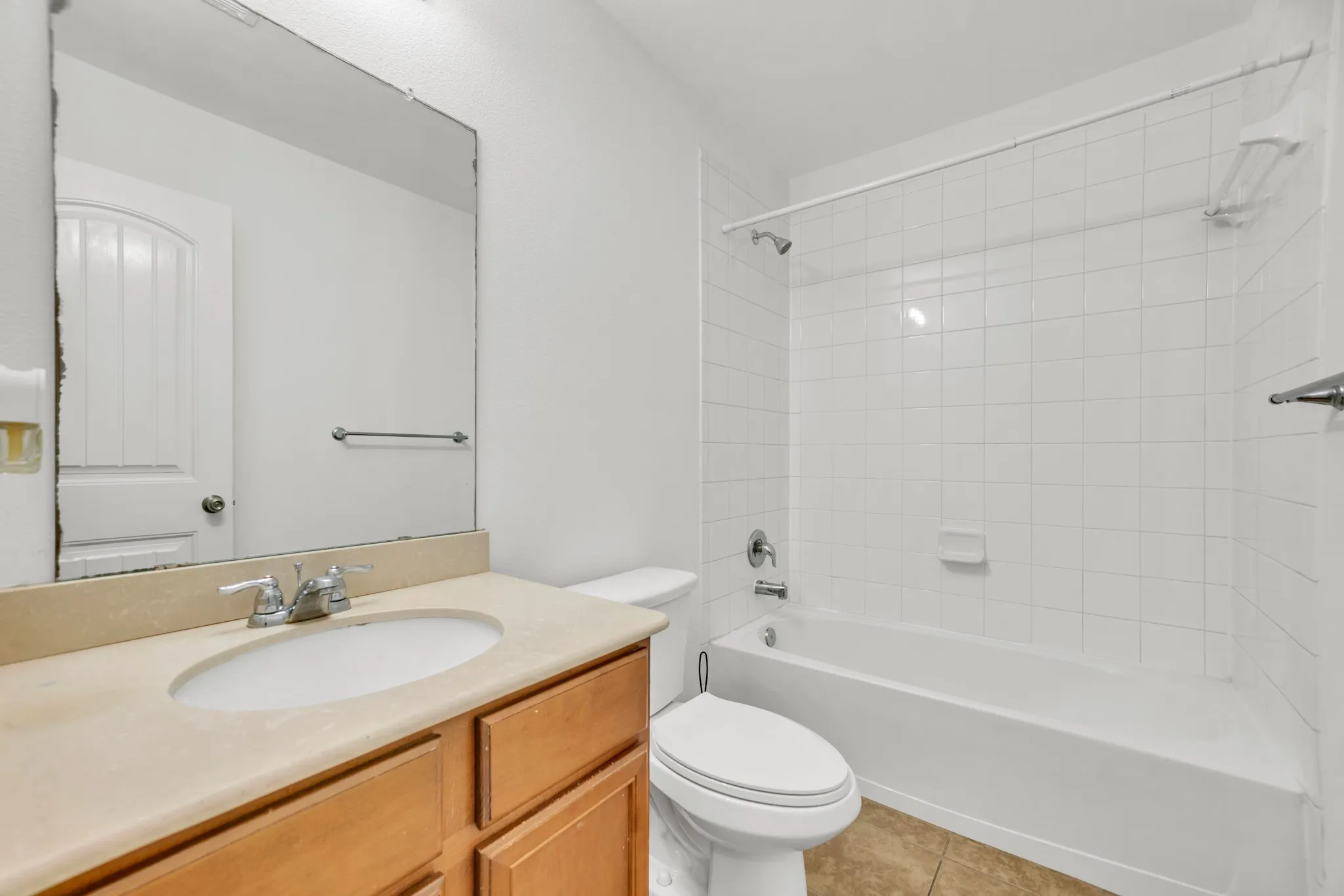 Bathroom featuring a vanity with a light-toned countertop and wood-finish cabinetry