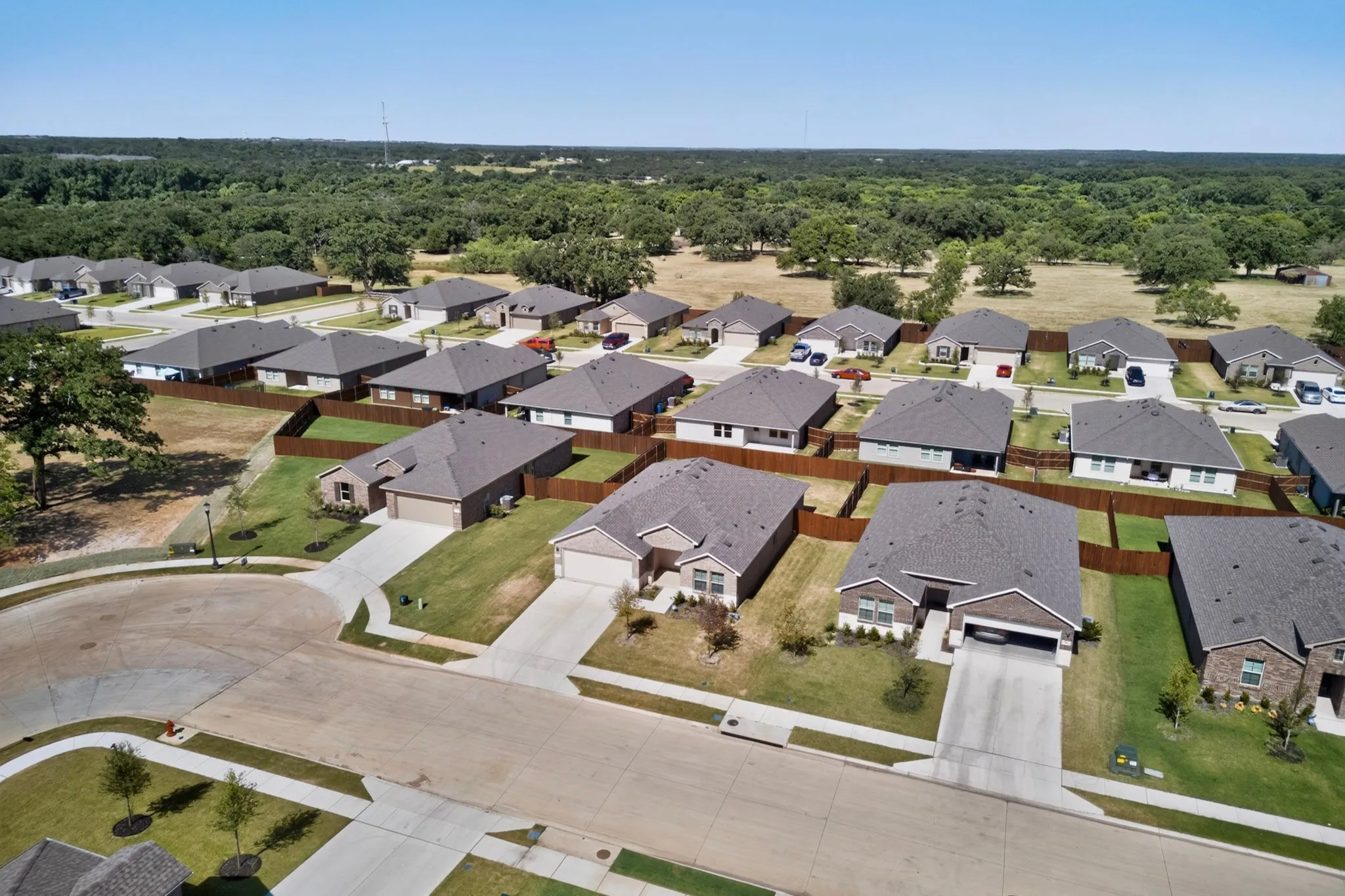 Suburban residential development featuring a cul-de-sac and single-story homes
