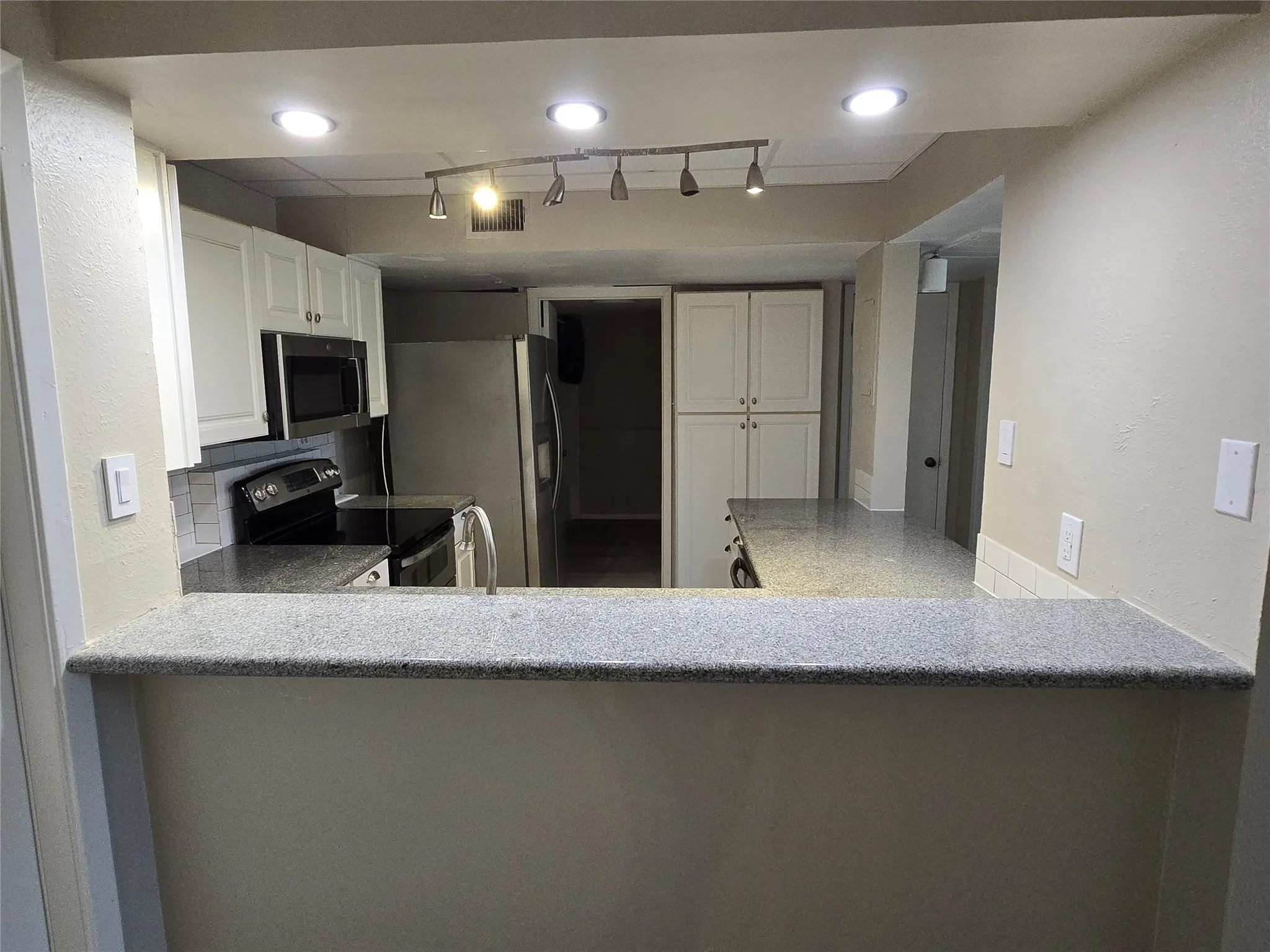 Kitchen pass-through to dining area