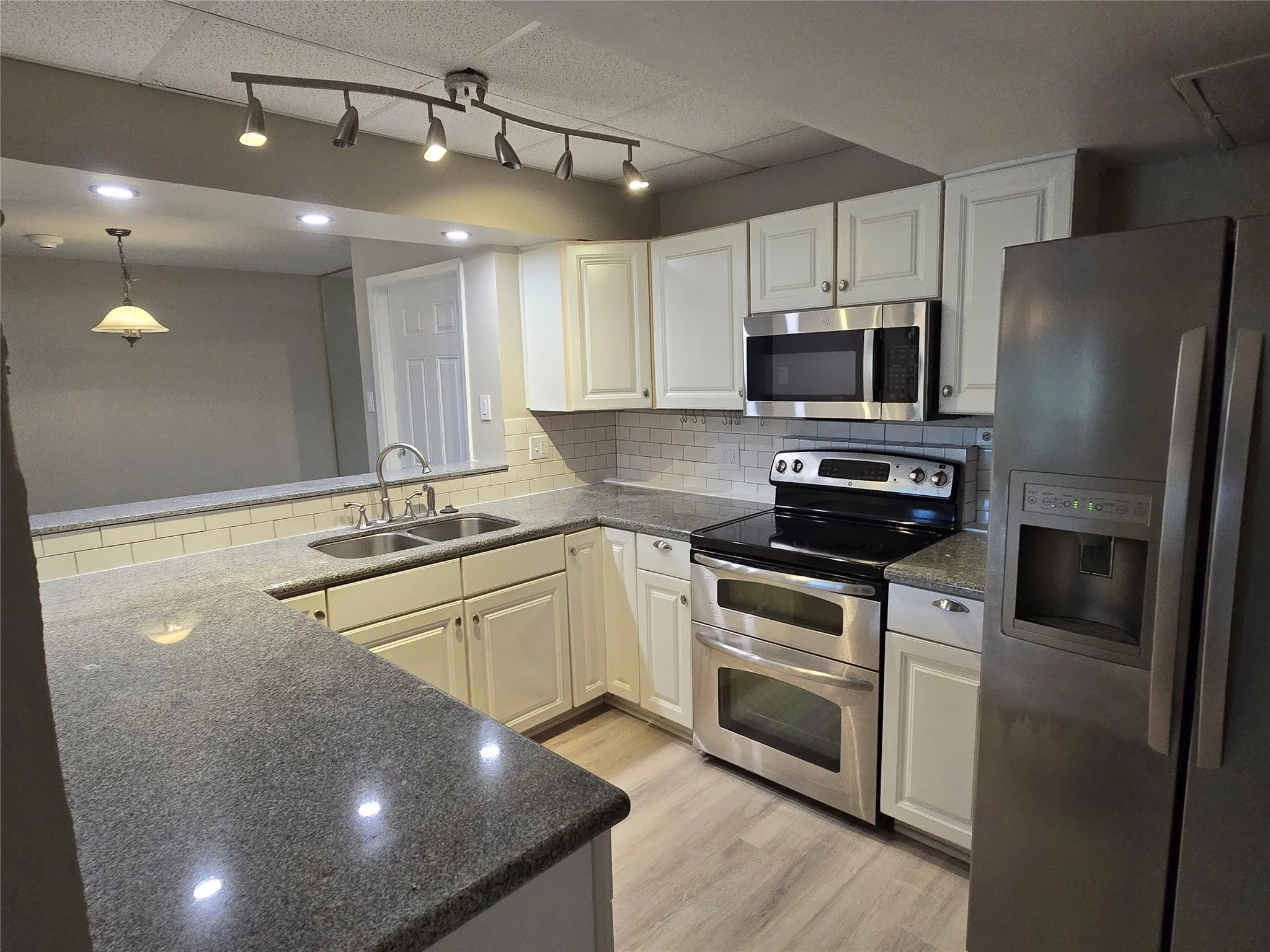 Kitchen featuring granite countertops and SS appliances