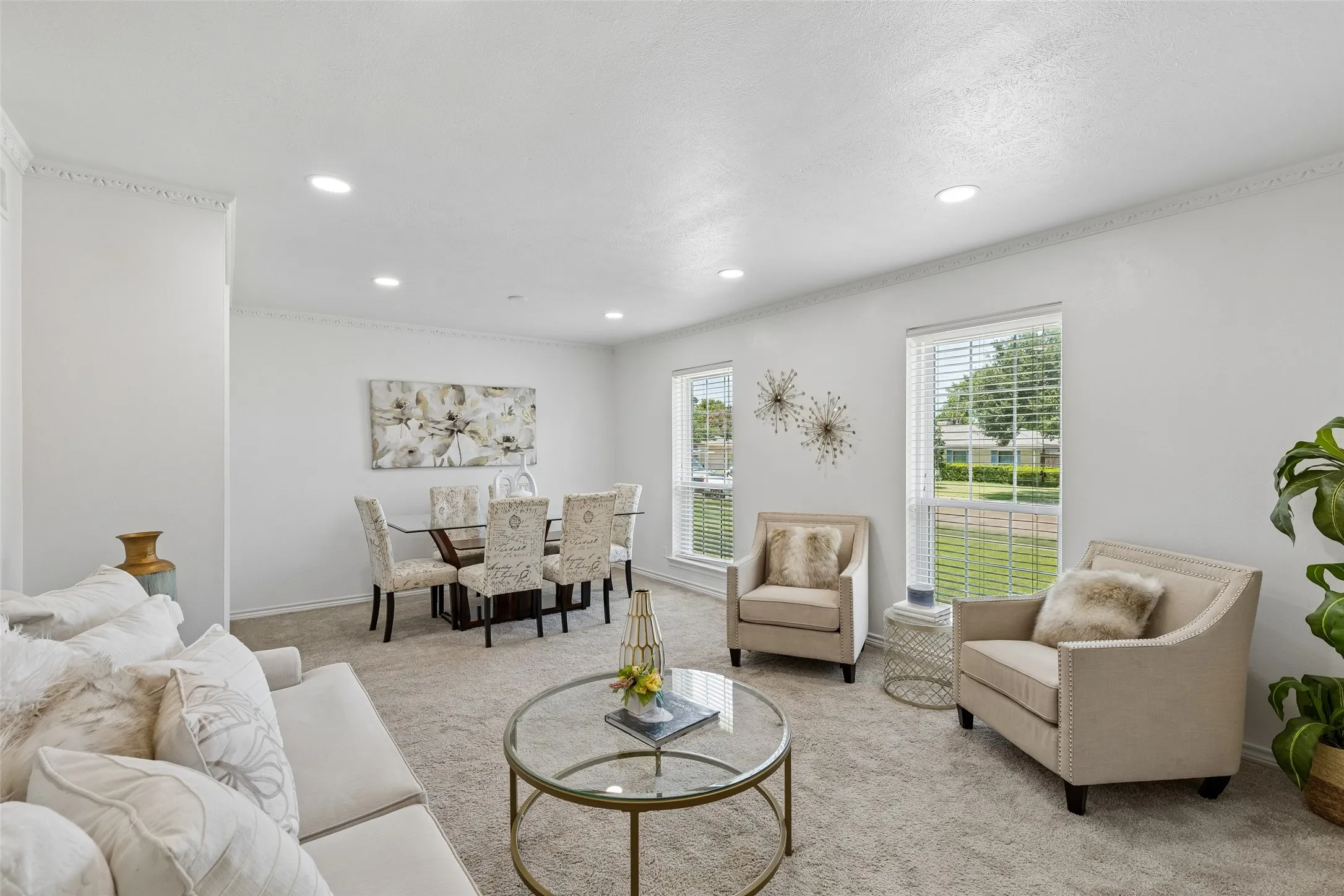 Front living and dining room with views to the front yard. Upgraded Windows, LED lighting, fresh paint and carpet.