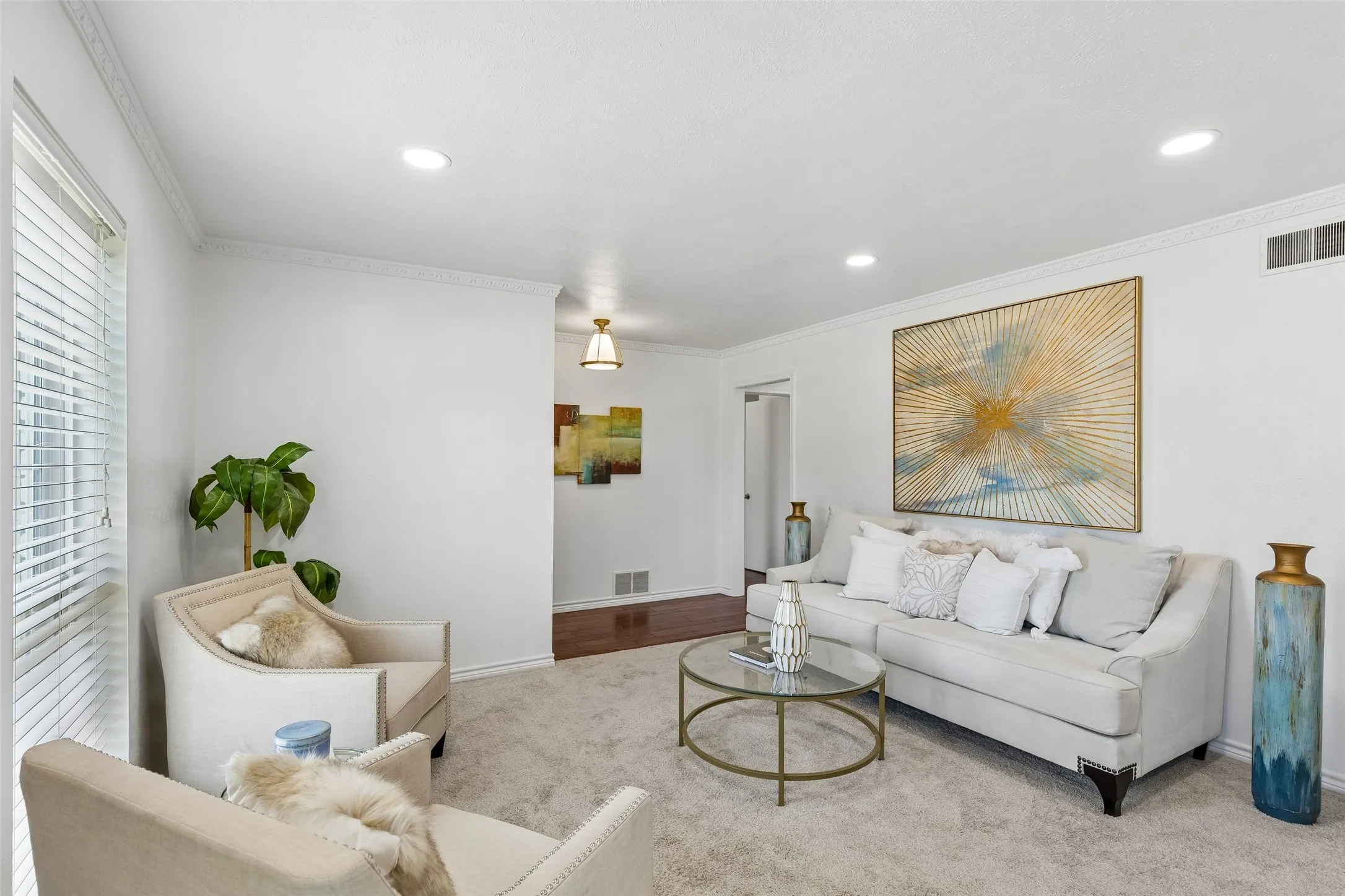 Front living and dining area off the foyer. Views to the front yard with large Pella Windows!