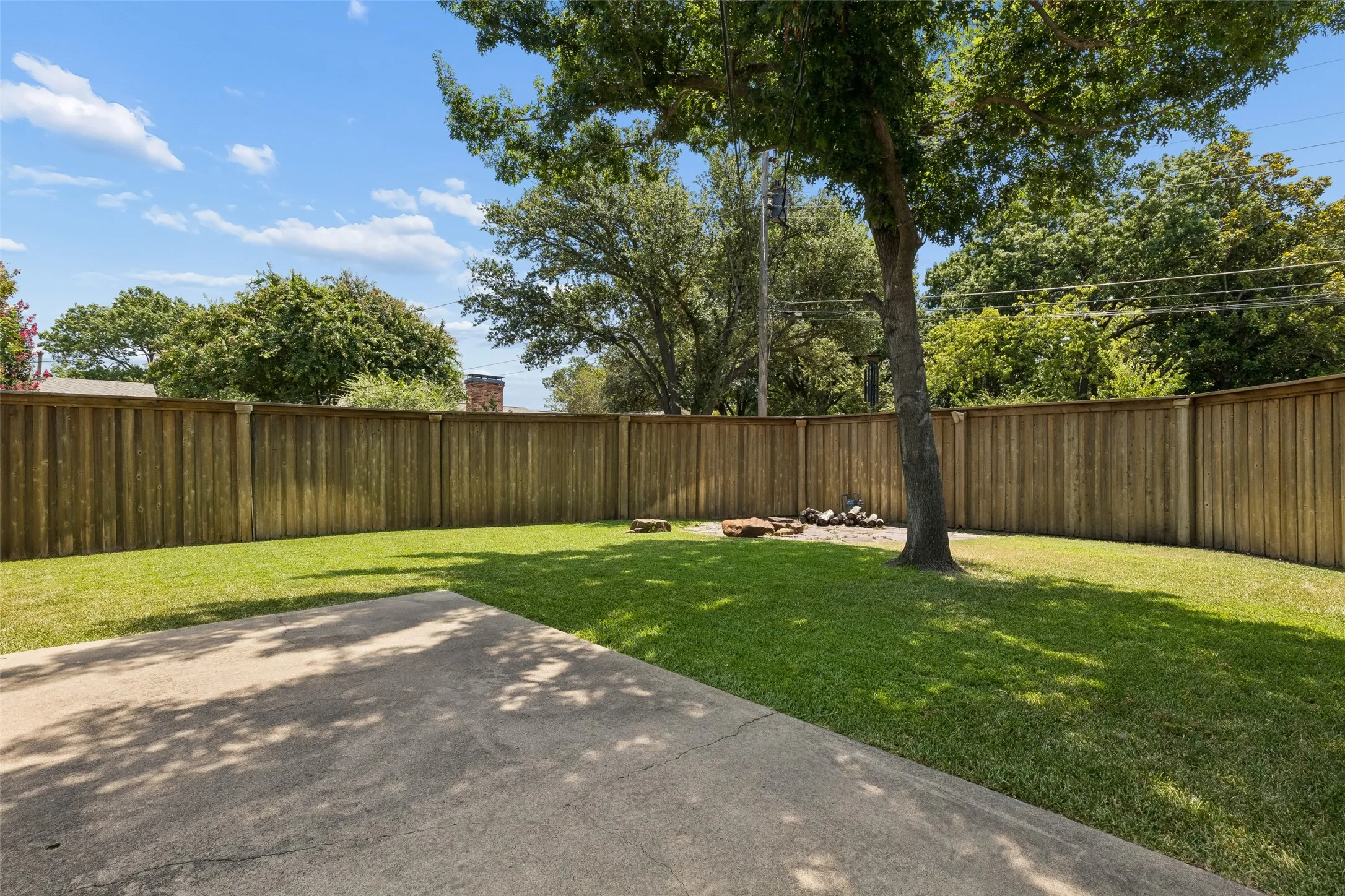Back yard is surrounded by a quality 8 ft fence! This expensive upgrade is one of many. (Ask Janelle for full list of upgrades) *Note that the neighboring house do not have windows into the backyard.