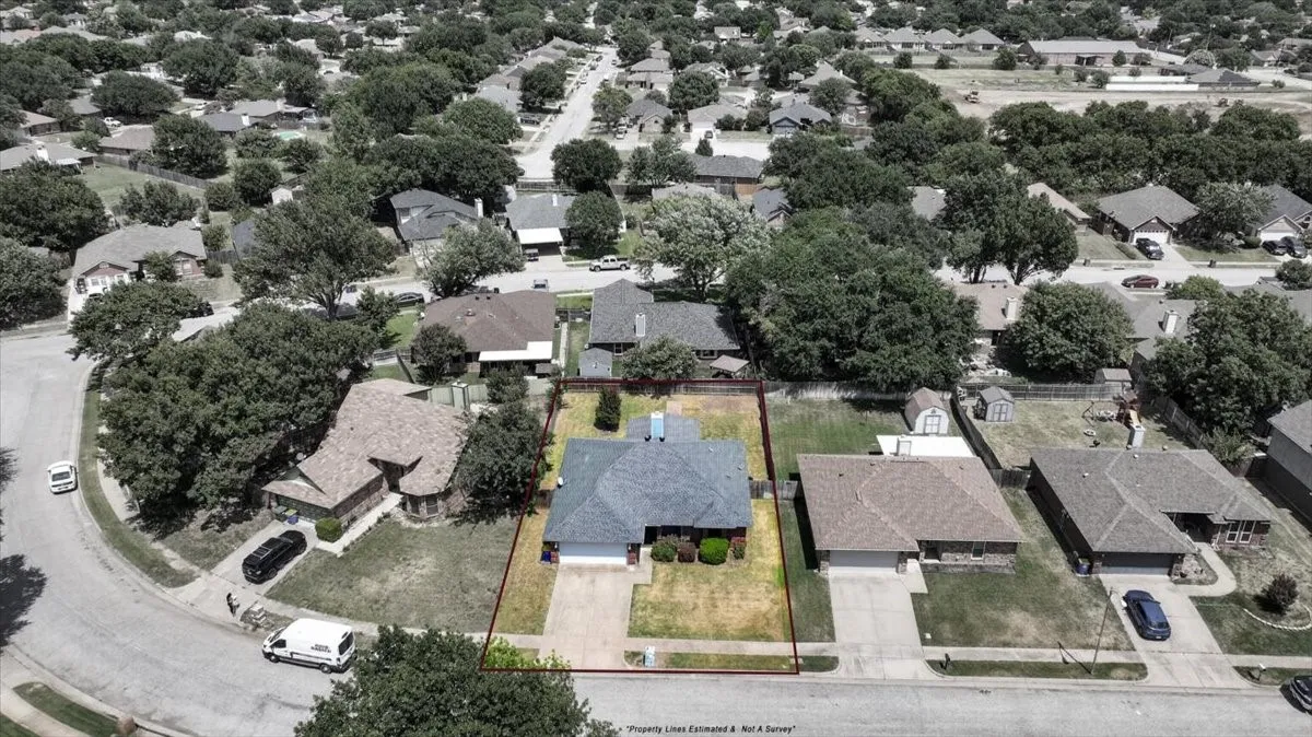 Single-story home featuring a gray shingle roof and an attached two-car garage