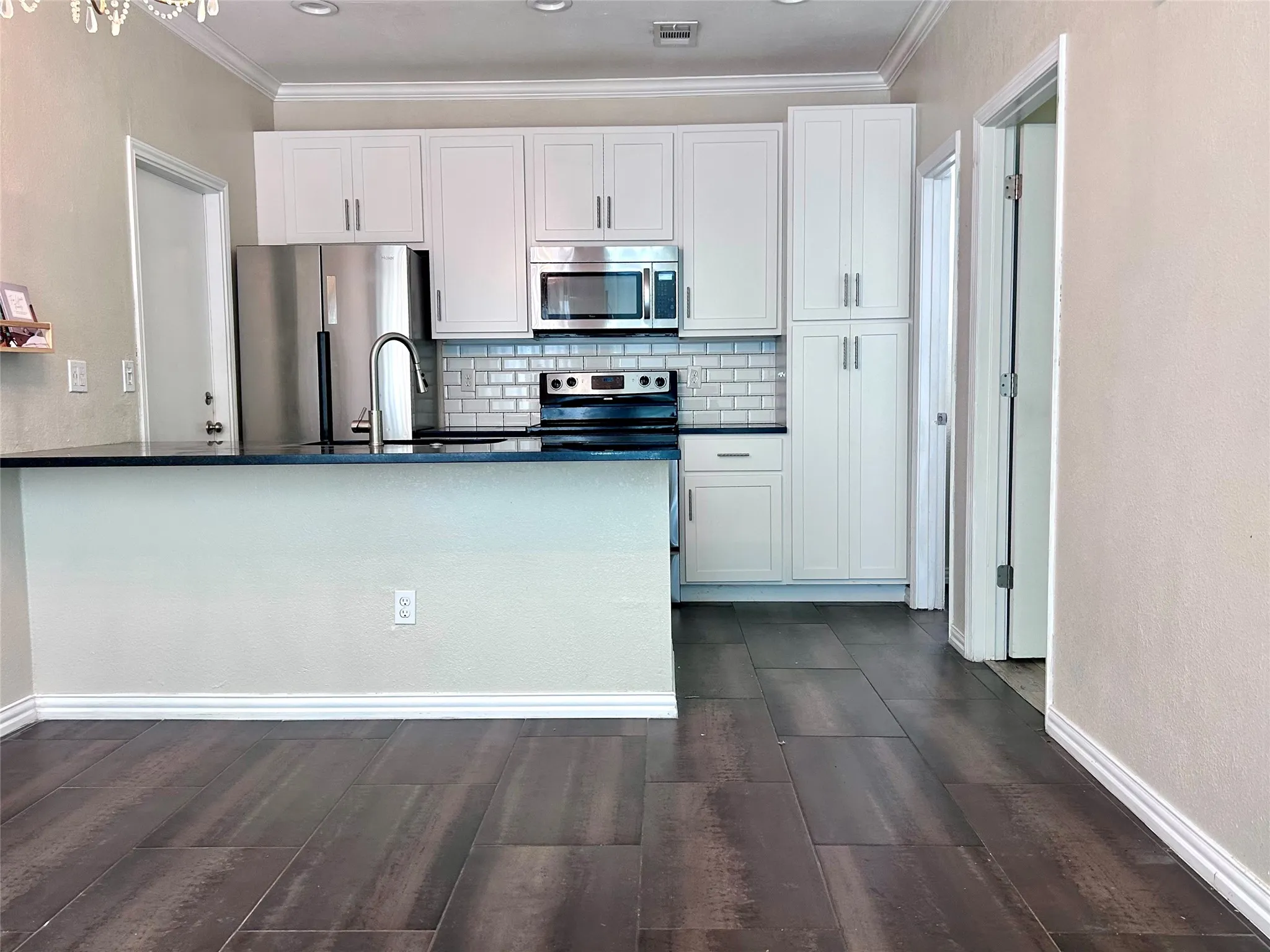 The kitchen is updated with stainless appliances and granite counter top.